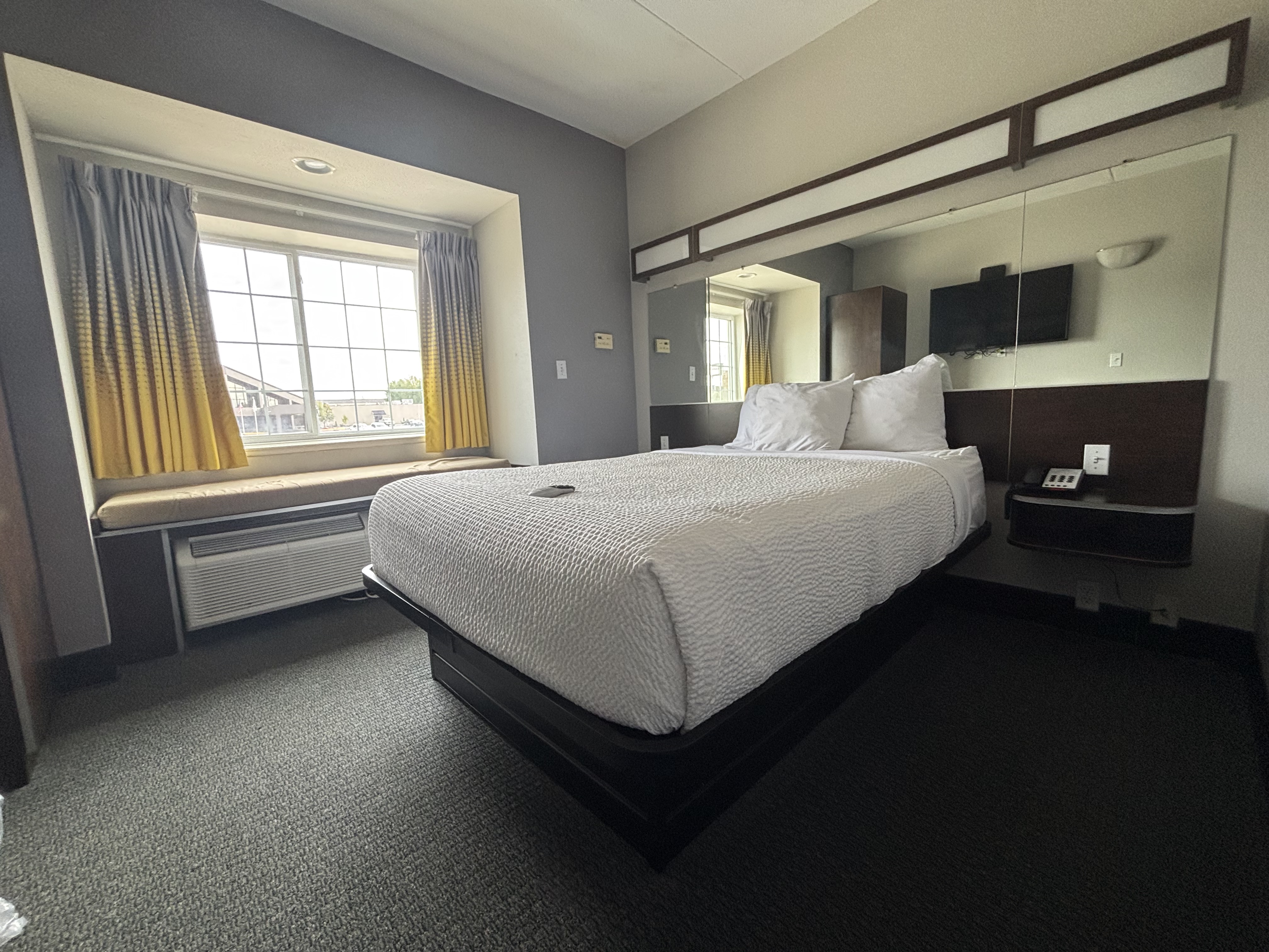 King bed guest room at the Microtel Inn & Suites by Wyndham Quincy Downtown/River Area in Quincy, Illinois