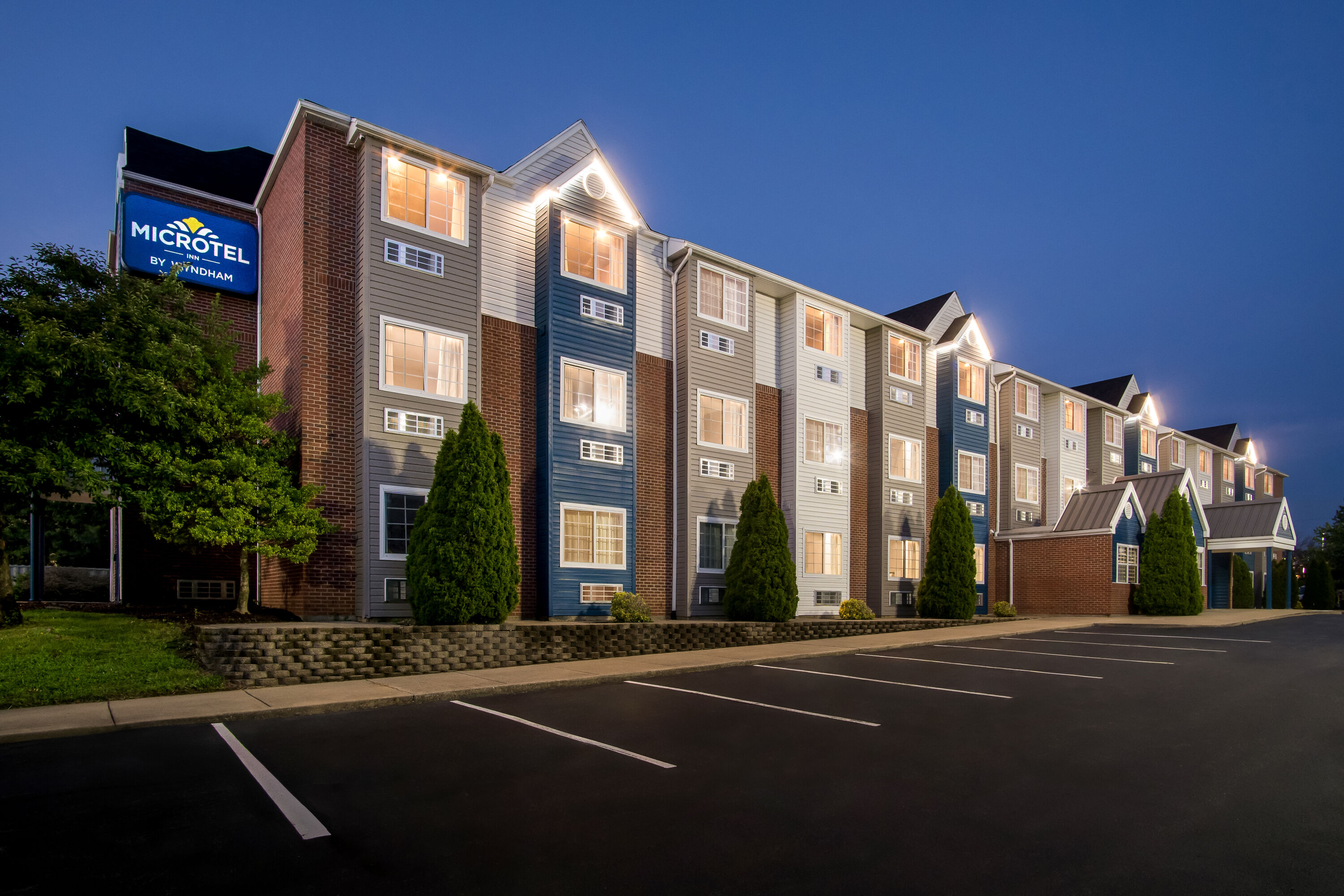 Exterior Night Image of Microtel Inn & Suites by Wyndham Georgetown hotel in Georgetown, Kentucky