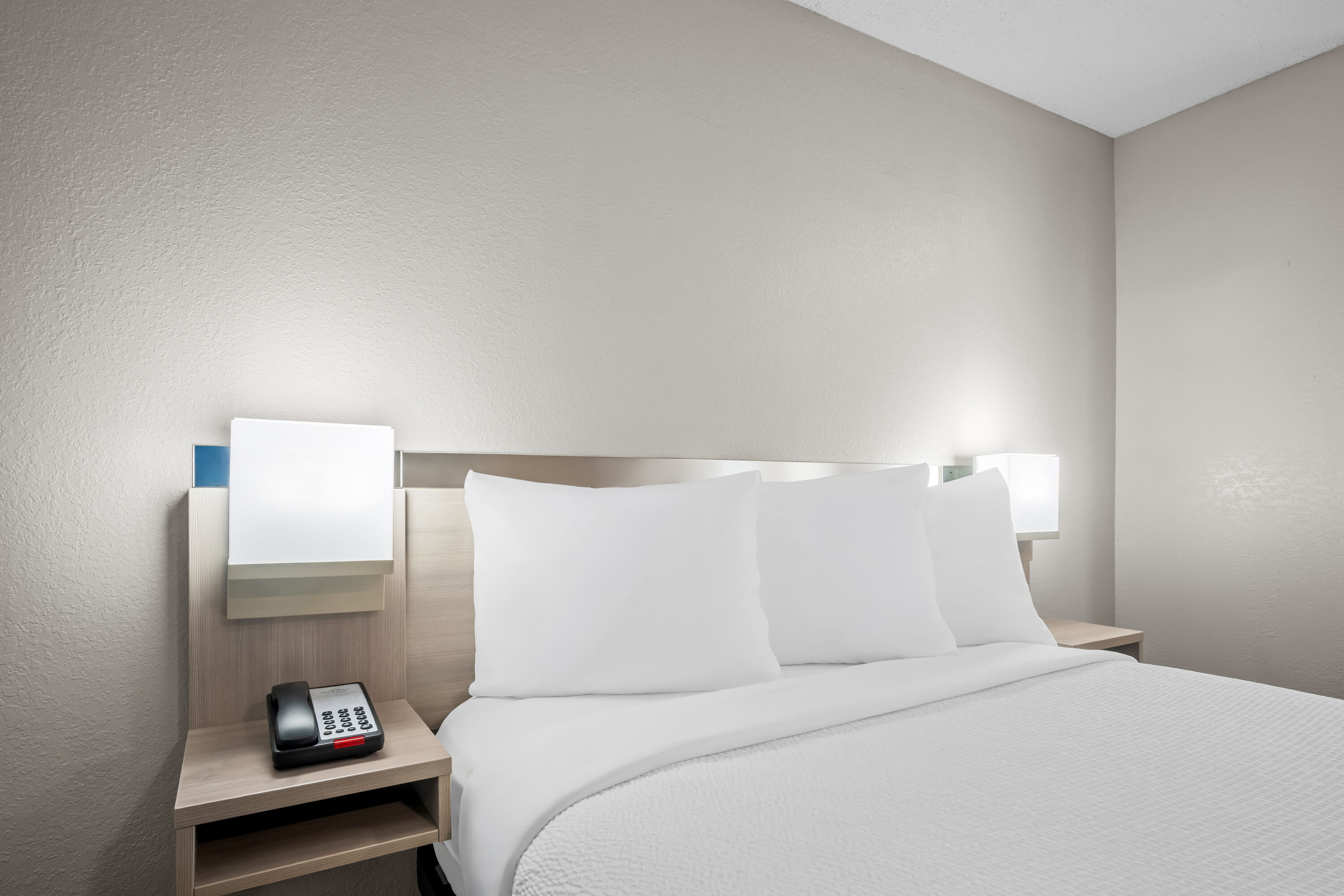 Queen bed guest room at the Microtel Inn & Suites by Wyndham Georgetown in Georgetown, Kentucky