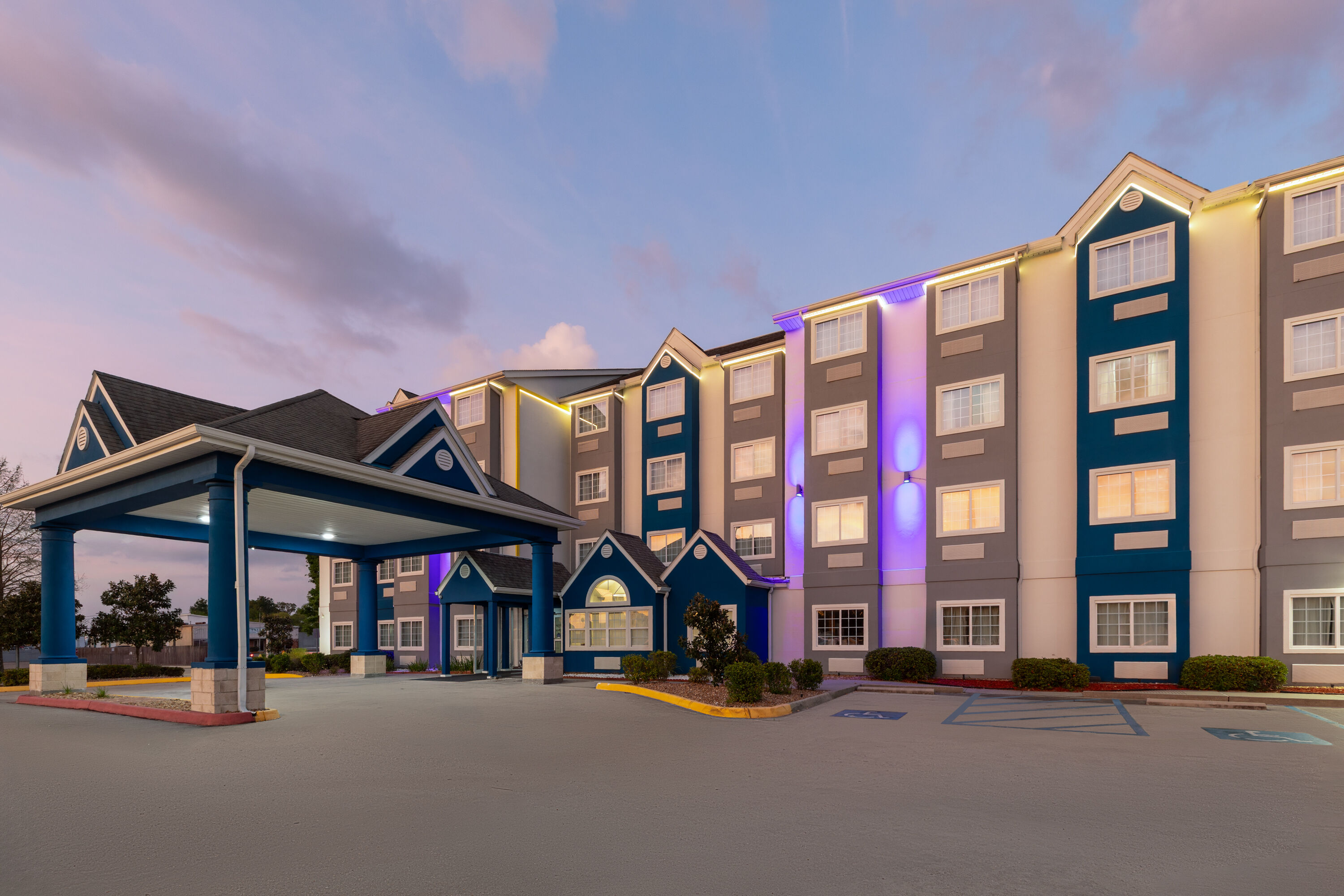 Exterior Dusk Image of Microtel Inn & Suites by Wyndham Baton Rouge Airport hotel in Baton Rouge, Louisiana