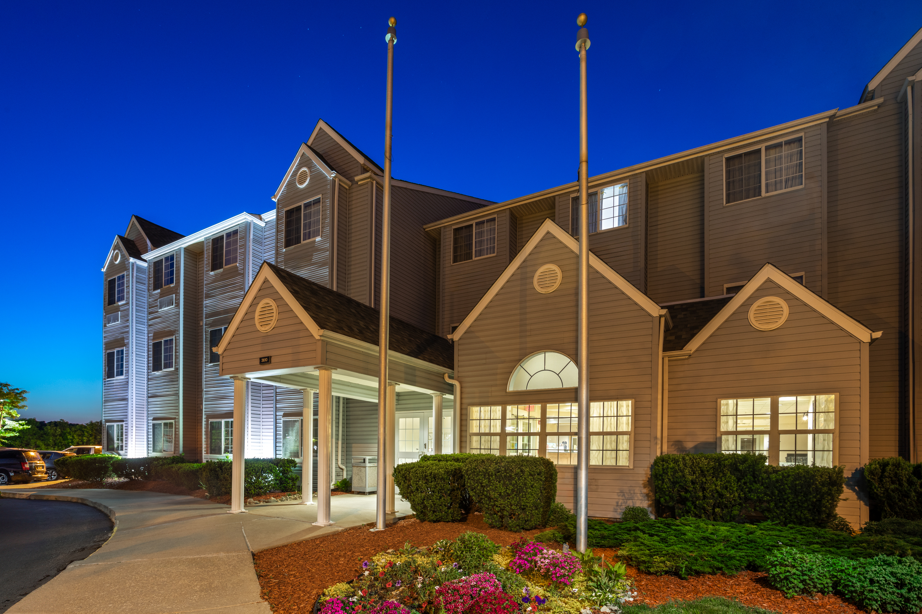 Exterior Dusk Image of Microtel Inn & Suites by Wyndham Ann Arbor hotel in Ann Arbor, Michigan