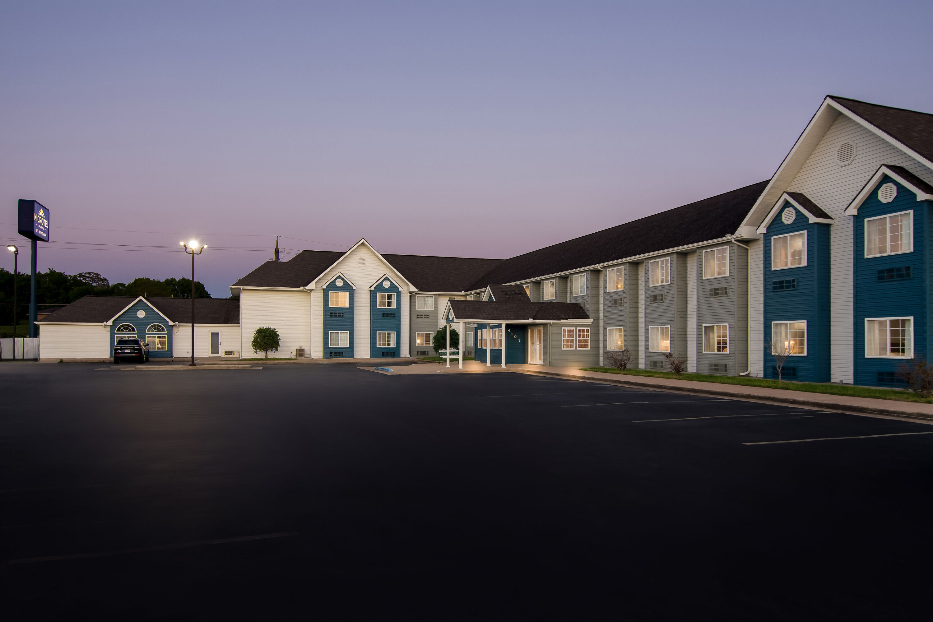 Exterior Night Image of Microtel Inn & Suites by Wyndham Joplin hotel in Joplin, Missouri