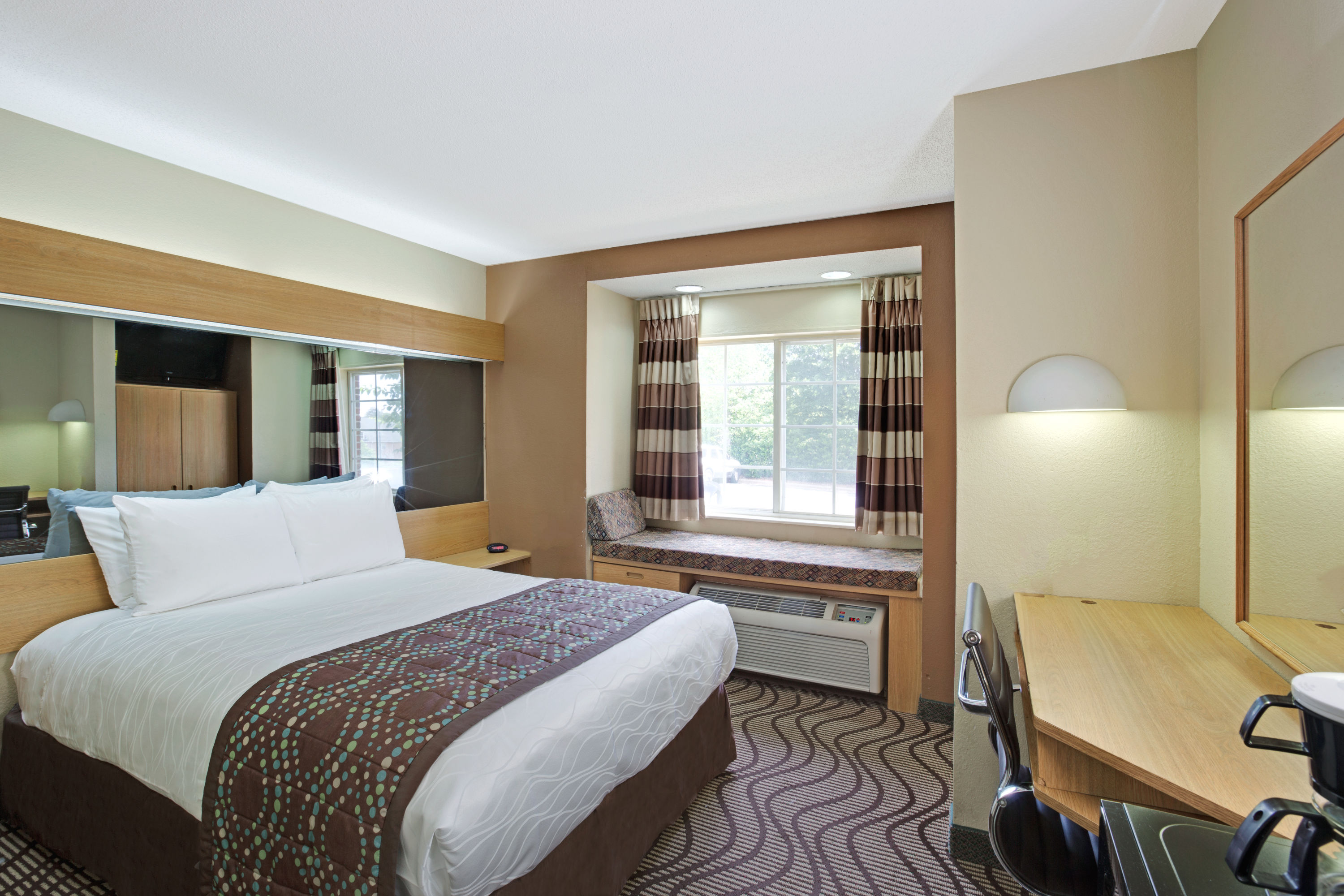 Guest room at the Microtel Inn & Suites by Wyndham Charlotte/University Place in Charlotte, North Carolina