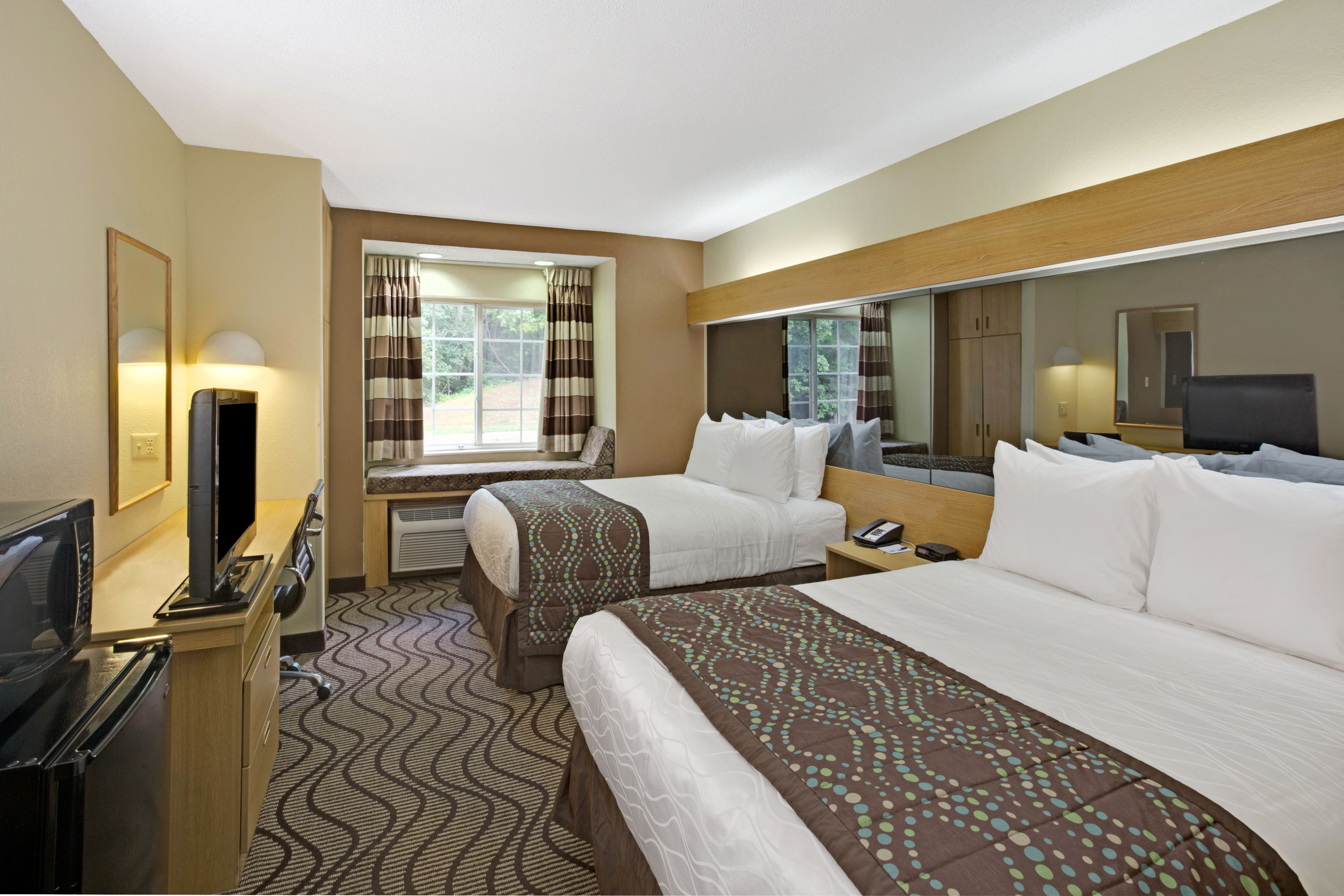 Guest room at the Microtel Inn & Suites by Wyndham Charlotte/University Place in Charlotte, North Carolina