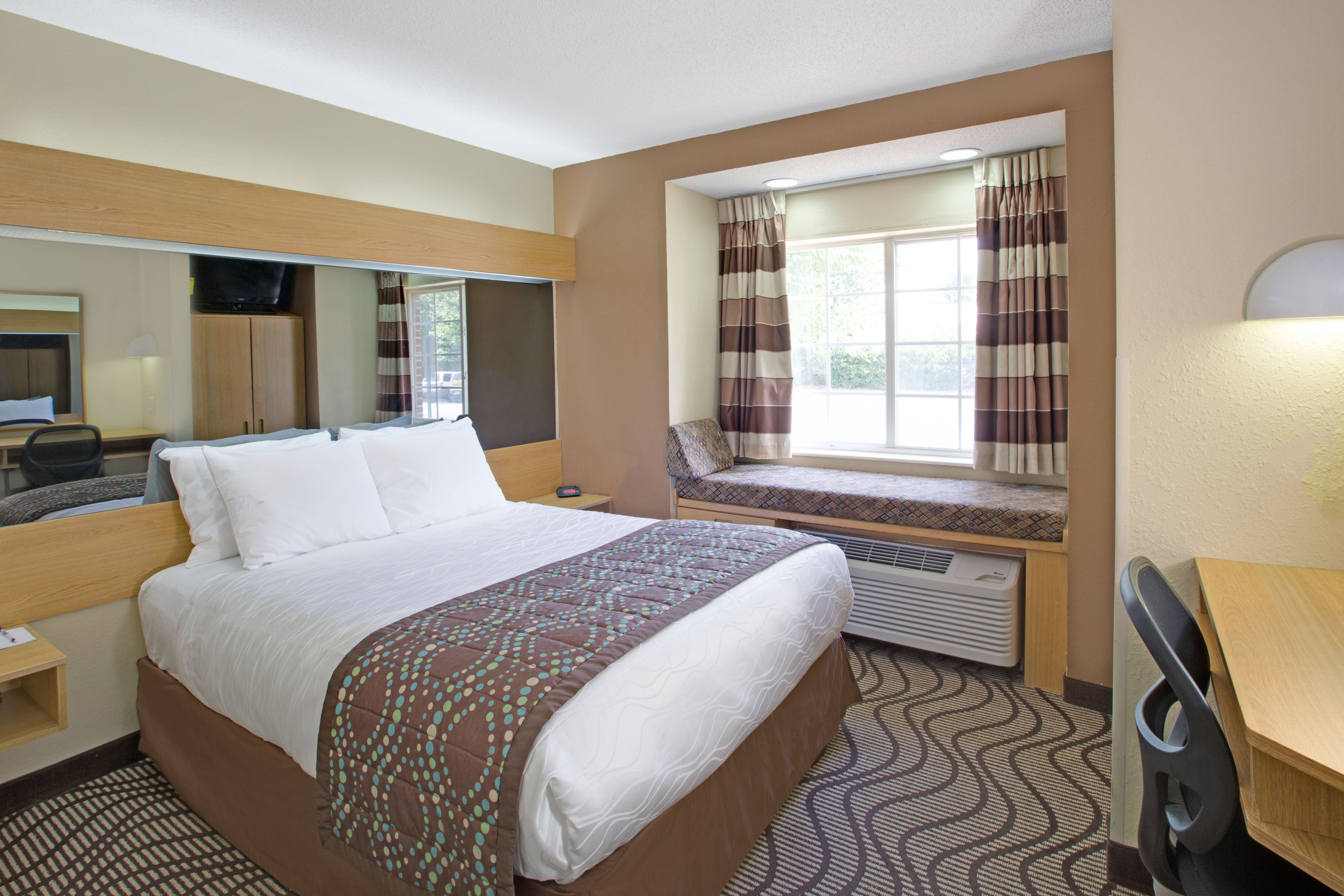 Guest room at the Microtel Inn & Suites by Wyndham Charlotte/University Place in Charlotte, North Carolina