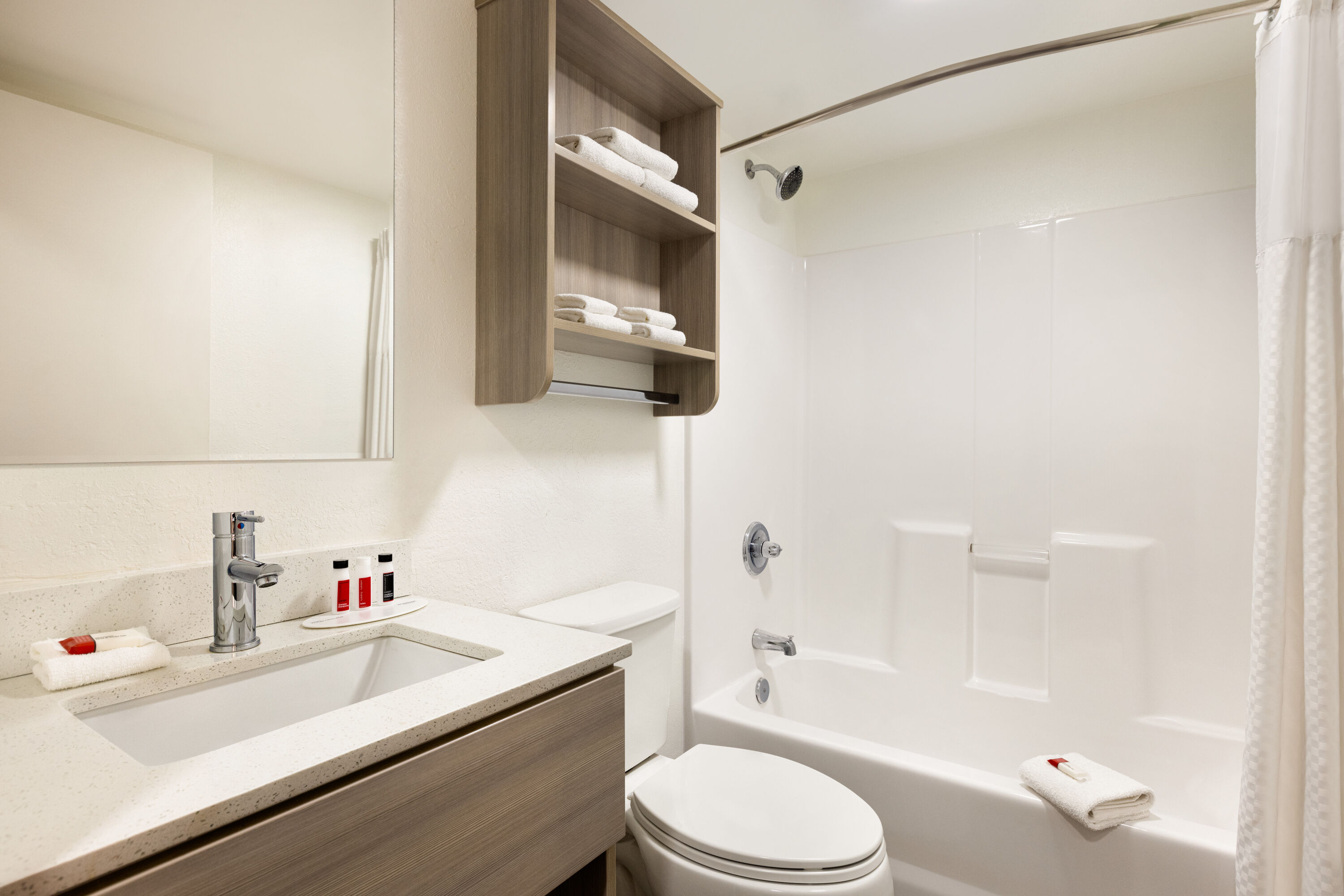 Guest room bath at the Microtel Inn & Suites by Wyndham Raleigh in Raleigh, North Carolina