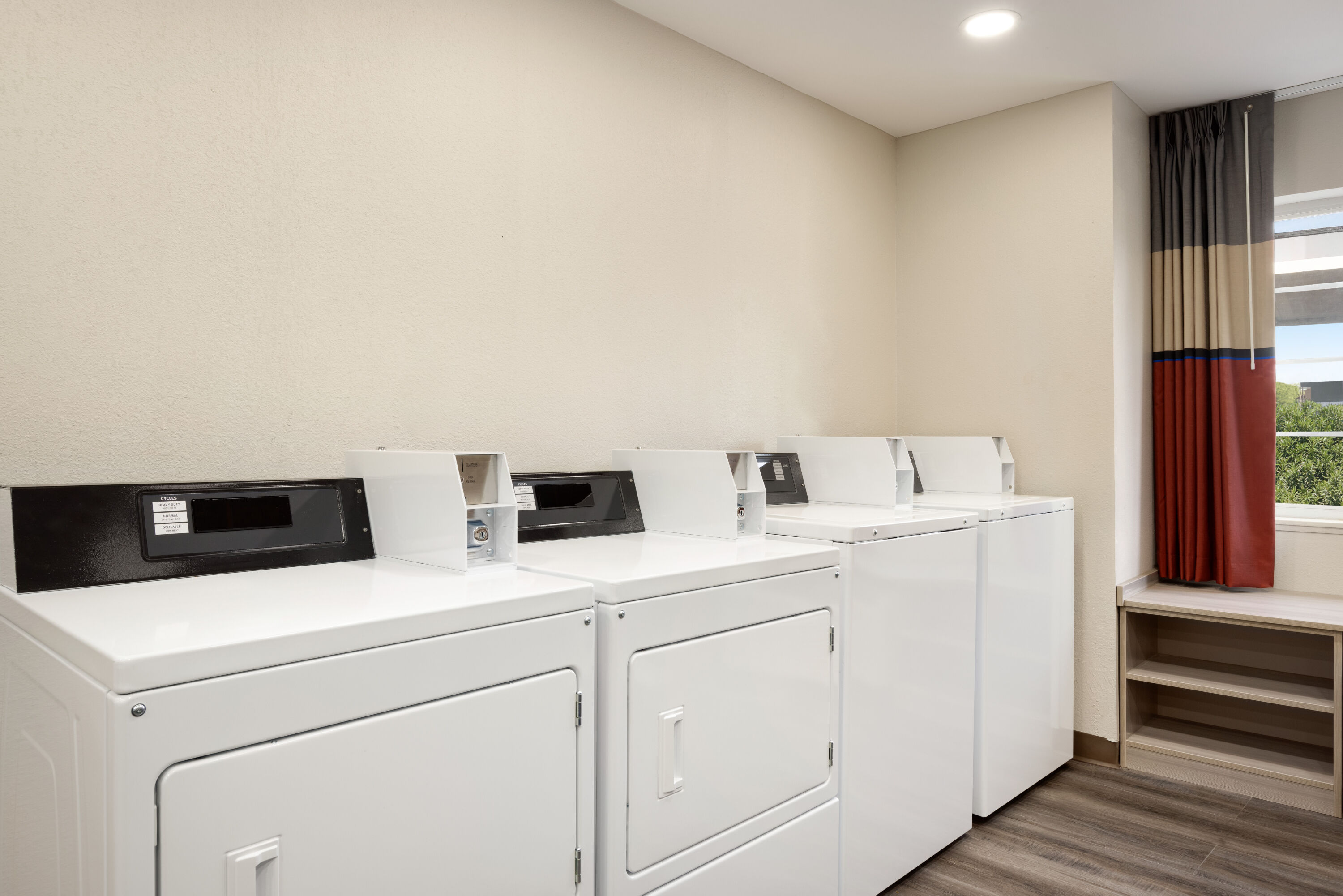 Laundry facilities at Microtel Inn & Suites by Wyndham Raleigh in Raleigh, North Carolina