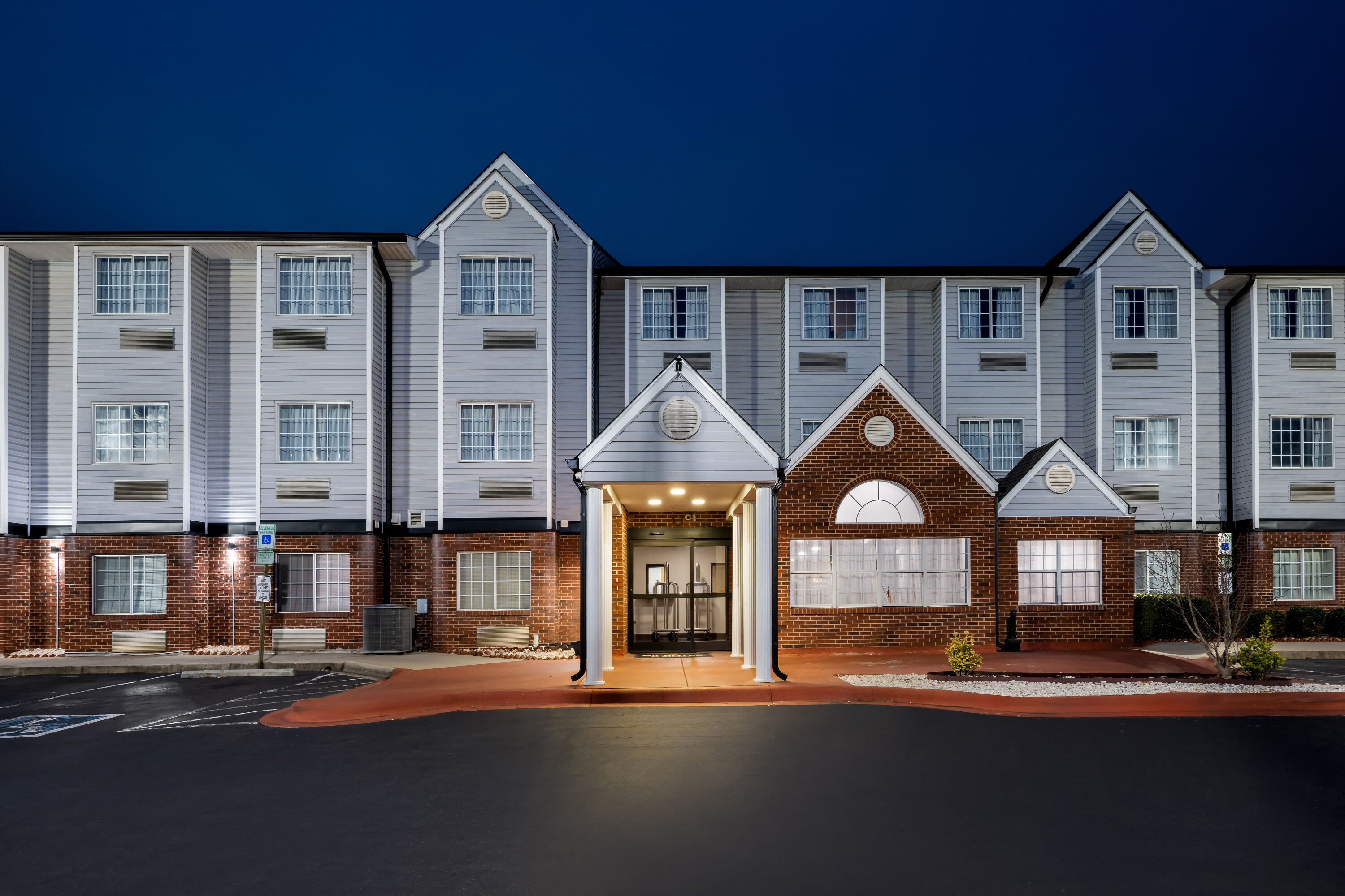 Exterior Night Image of Microtel Inn & Suites by Wyndham Statesville hotel in Statesville, North Carolina