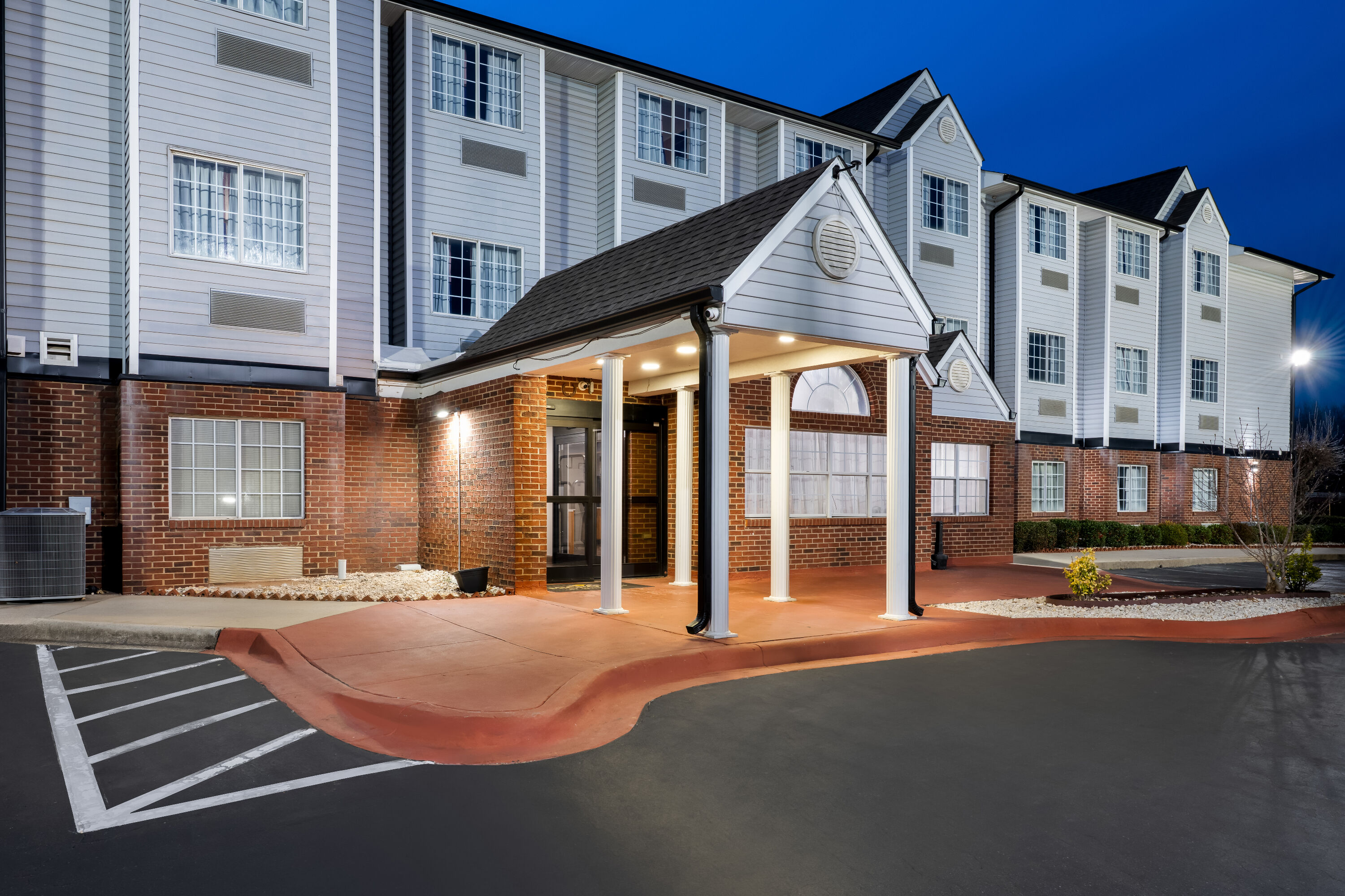 Exterior Night Image of Microtel Inn & Suites by Wyndham Statesville hotel in Statesville, North Carolina