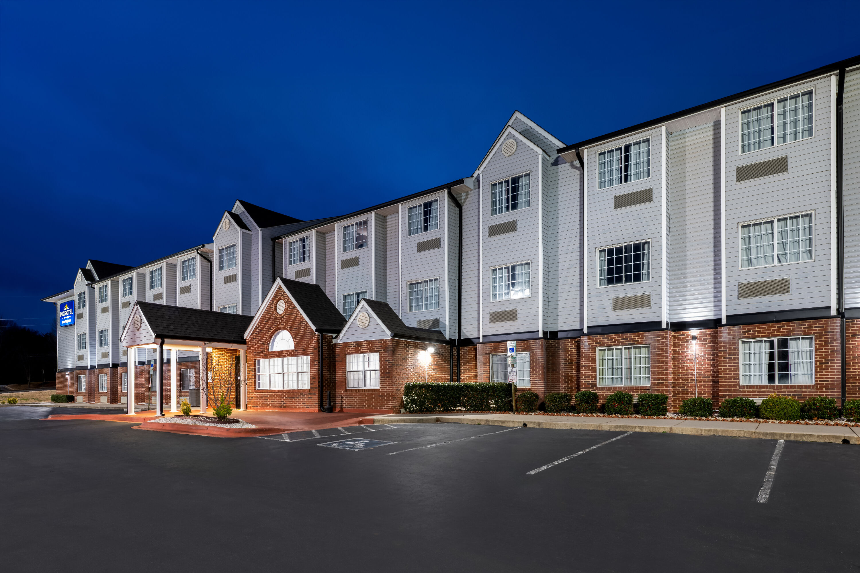 Exterior Night Image of Microtel Inn & Suites by Wyndham Statesville hotel in Statesville, North Carolina