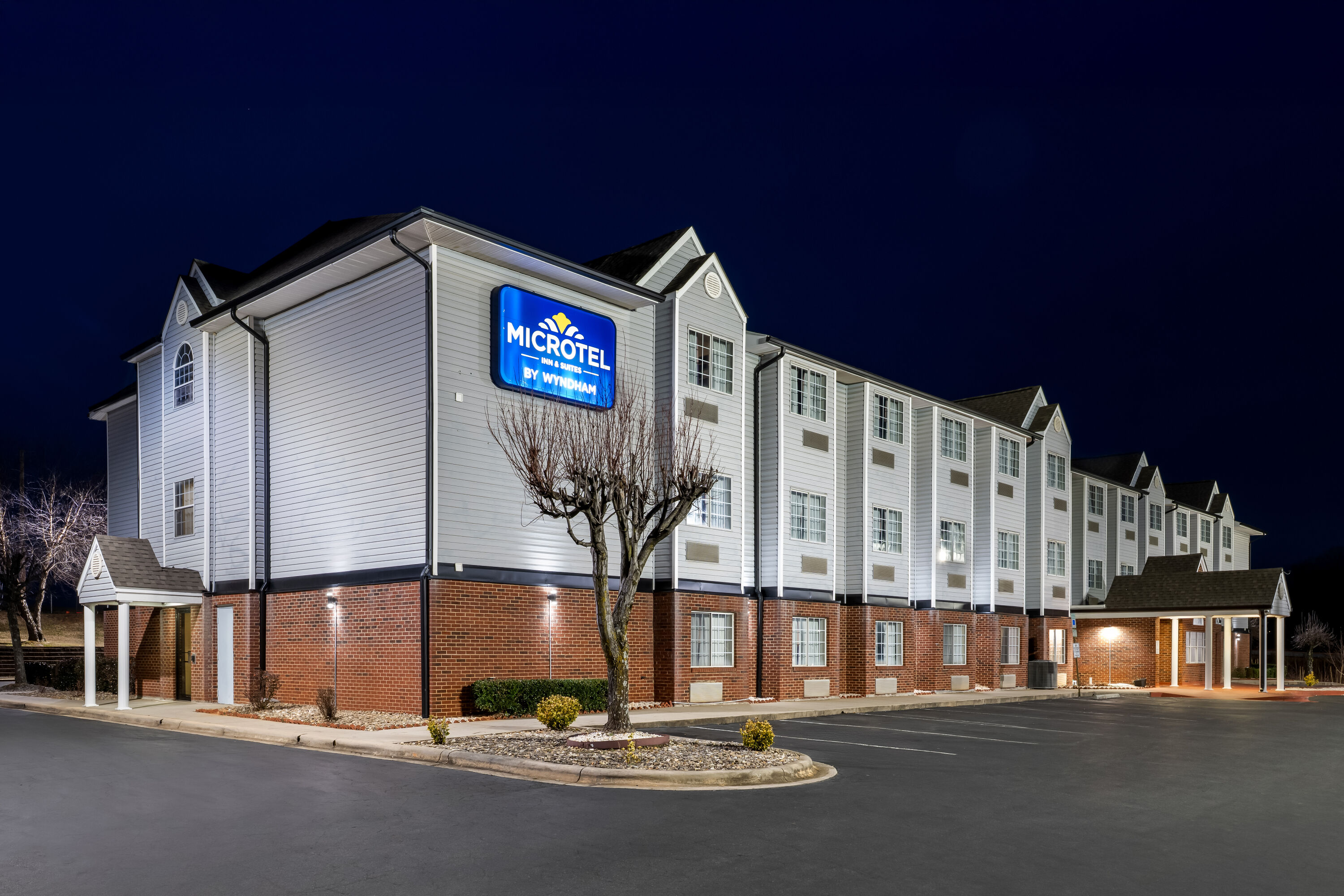 Exterior Night Image of Microtel Inn & Suites by Wyndham Statesville hotel in Statesville, North Carolina