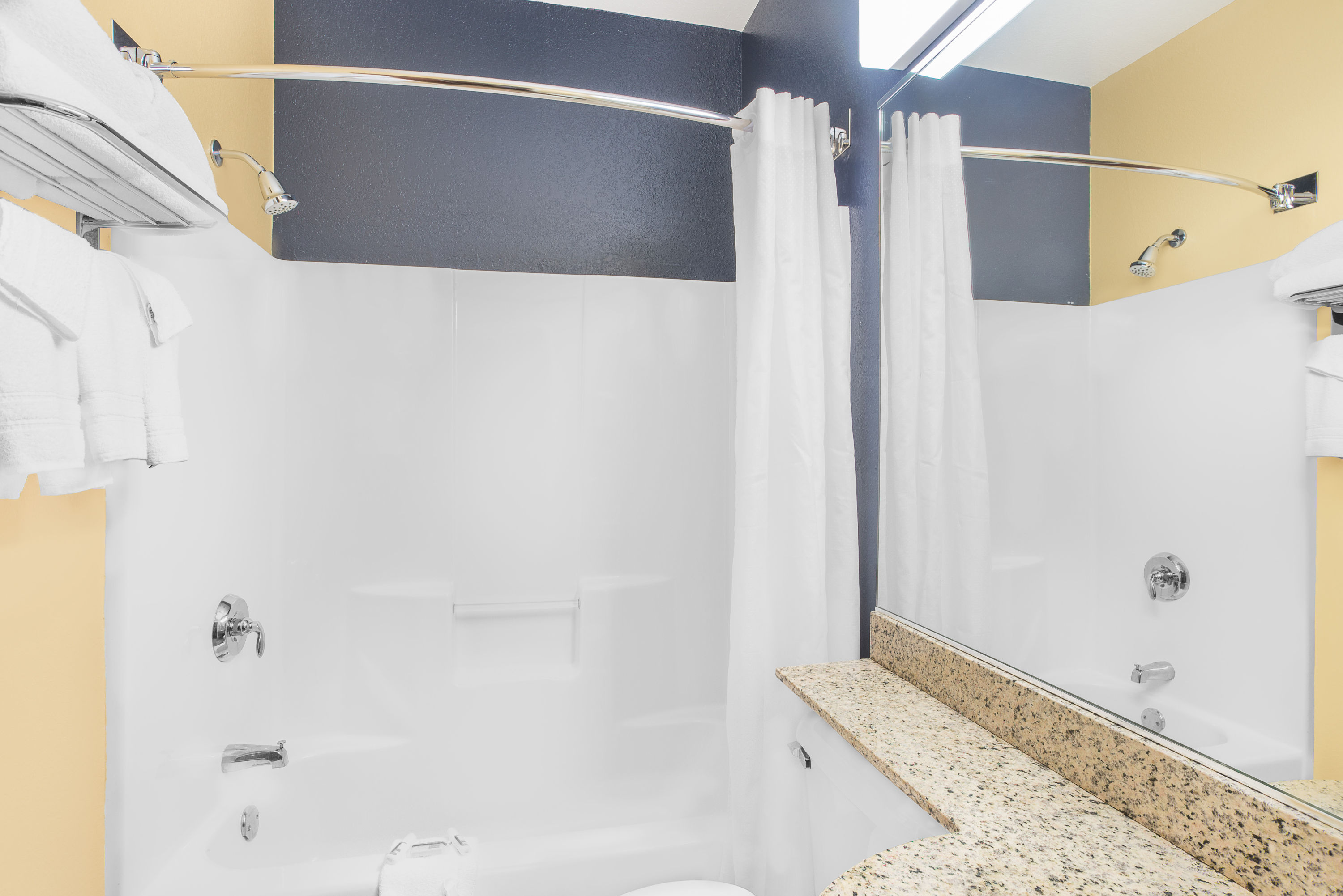 Guest room bath at the Microtel Inn & Suites by Wyndham Chili/Rochester Airport in Rochester, New York