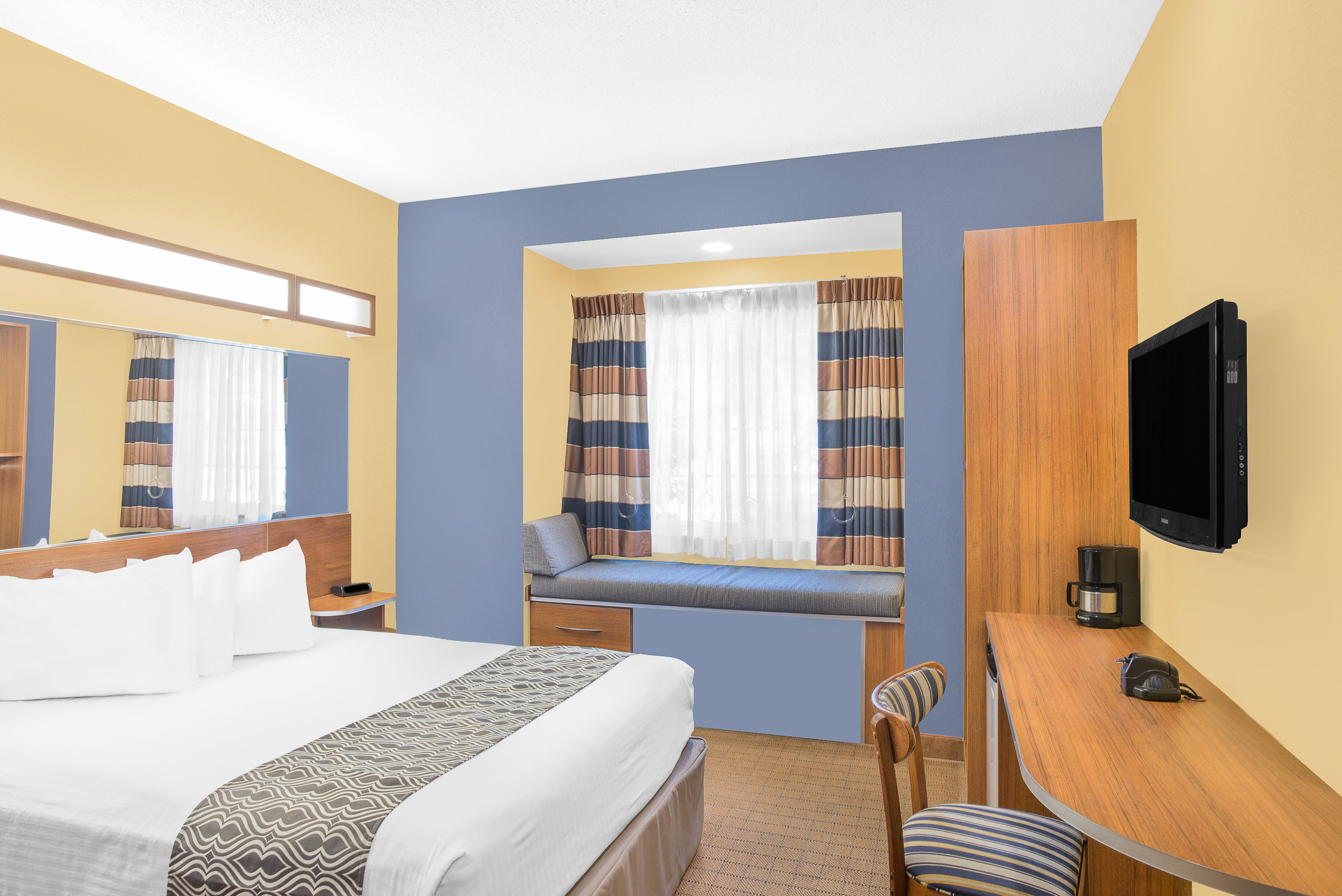 Guest room at the Microtel Inn & Suites by Wyndham Chili/Rochester Airport in Rochester, New York
