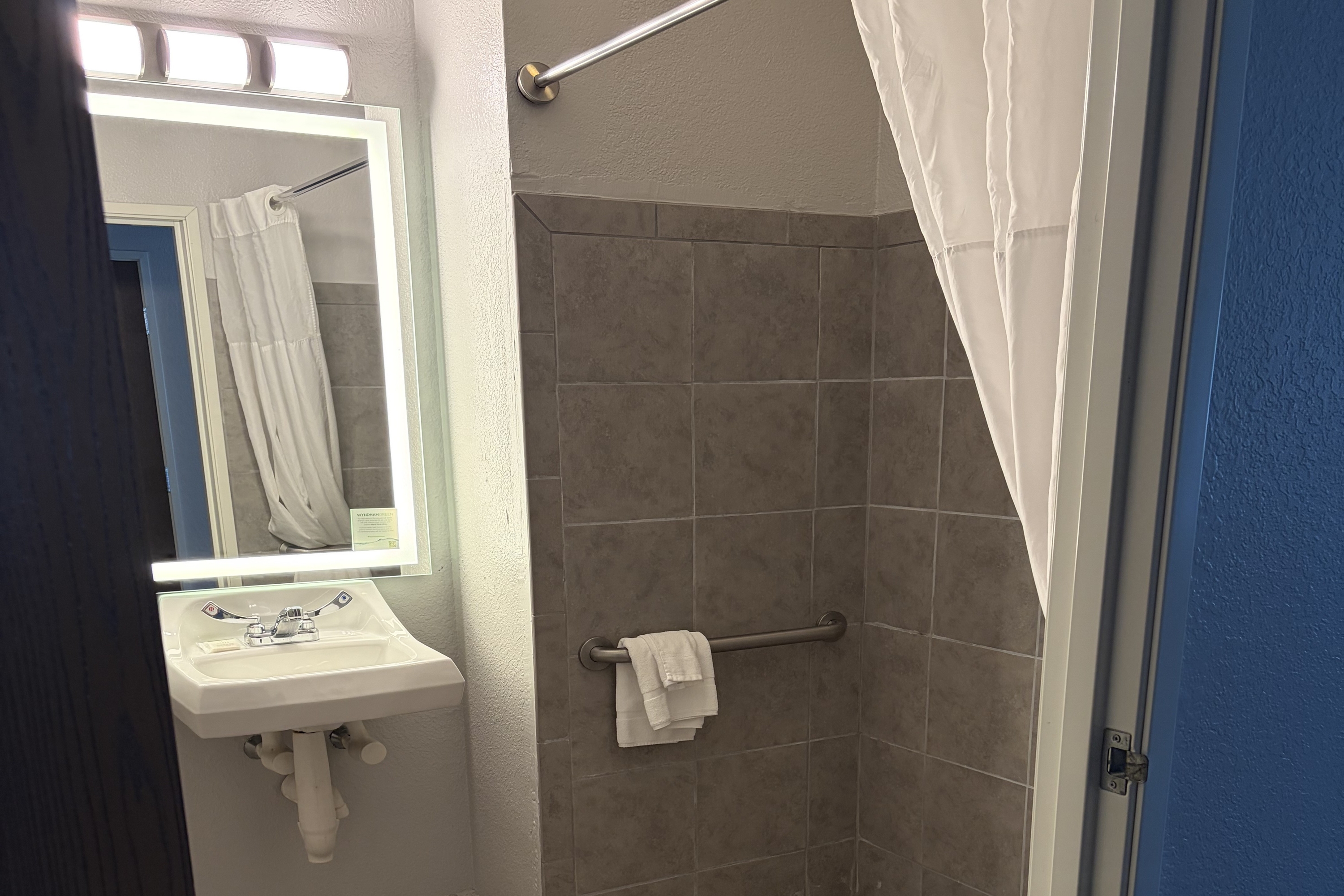 Guest room bath at the Microtel Inn & Suites by Wyndham Mansfield in Mansfield, Pennsylvania