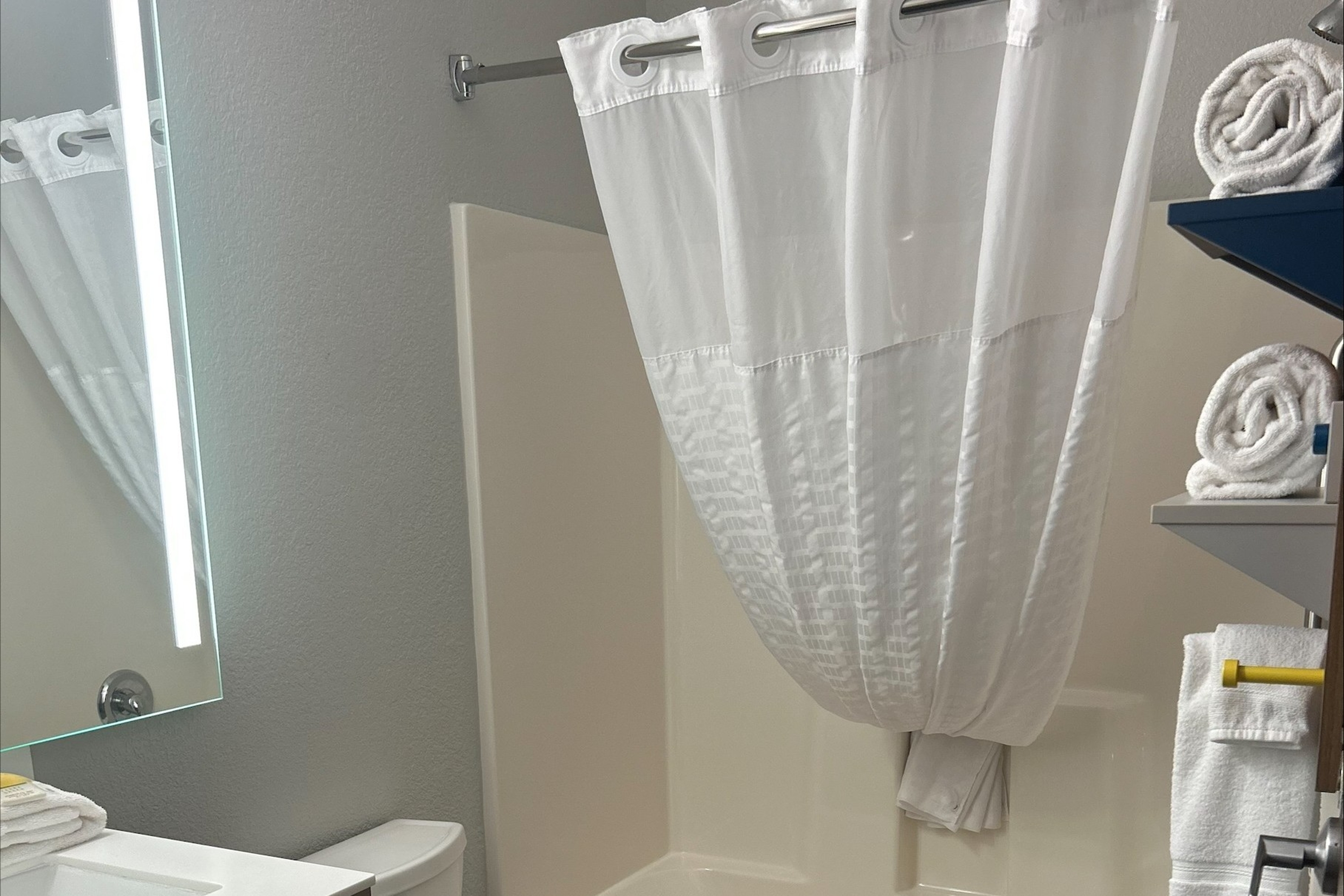 Guest room bath at the Microtel Inn & Suites by Wyndham Mansfield in Mansfield, Pennsylvania