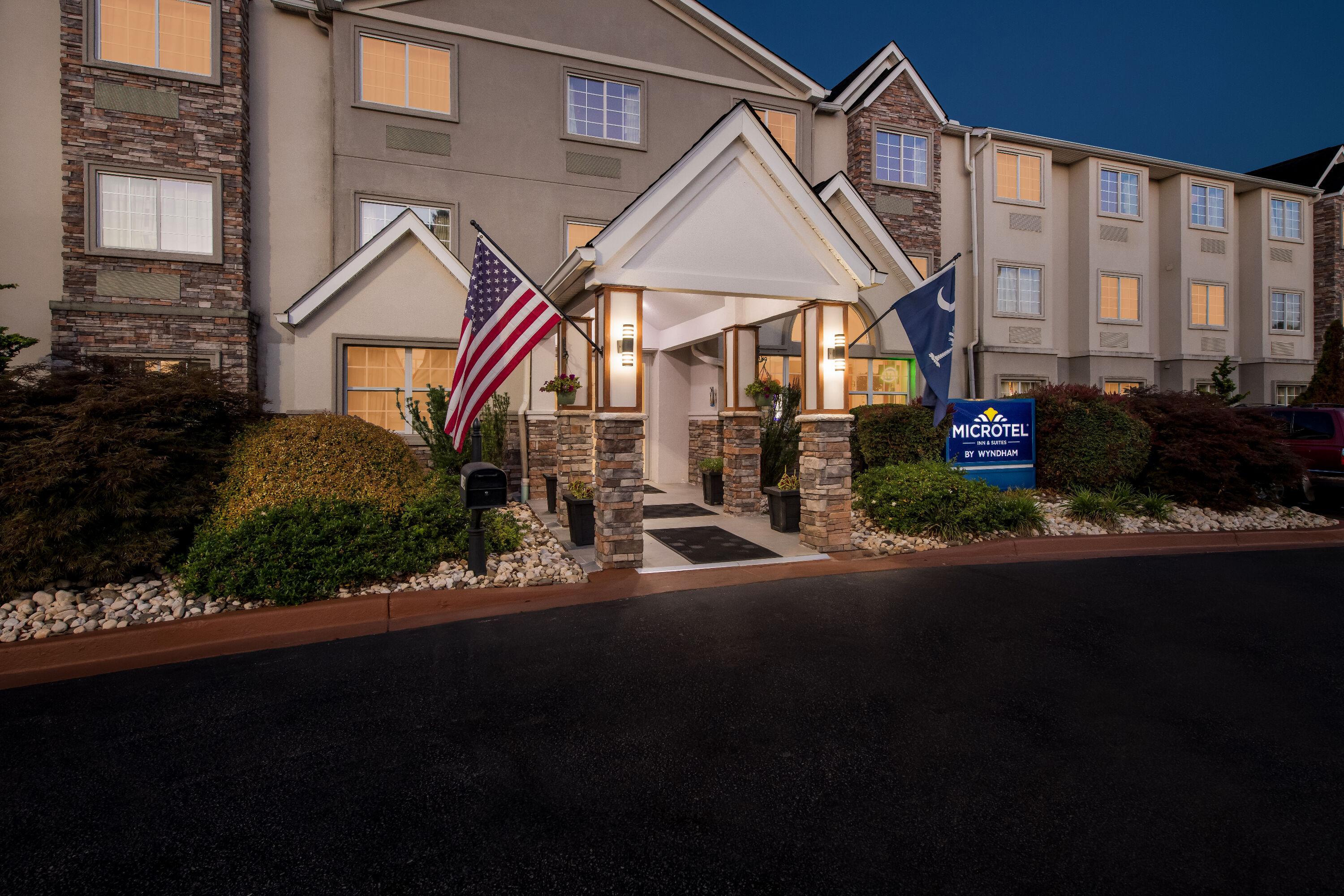 Exterior Night Image of Microtel Inn & Suites by Wyndham Greenville / Woodruff Rd hotel in Greenville, South Carolina