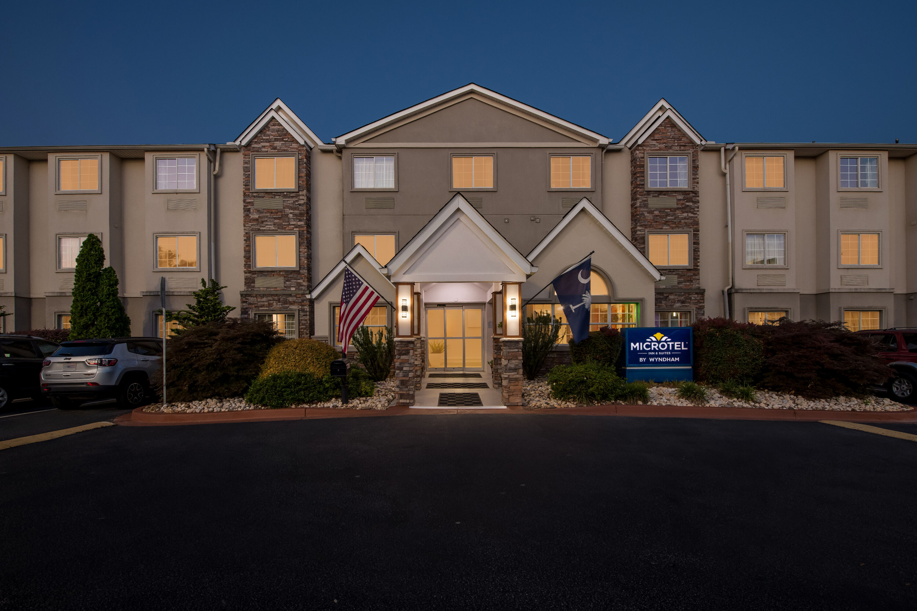 Exterior Night Image of Microtel Inn & Suites by Wyndham Greenville / Woodruff Rd hotel in Greenville, South Carolina