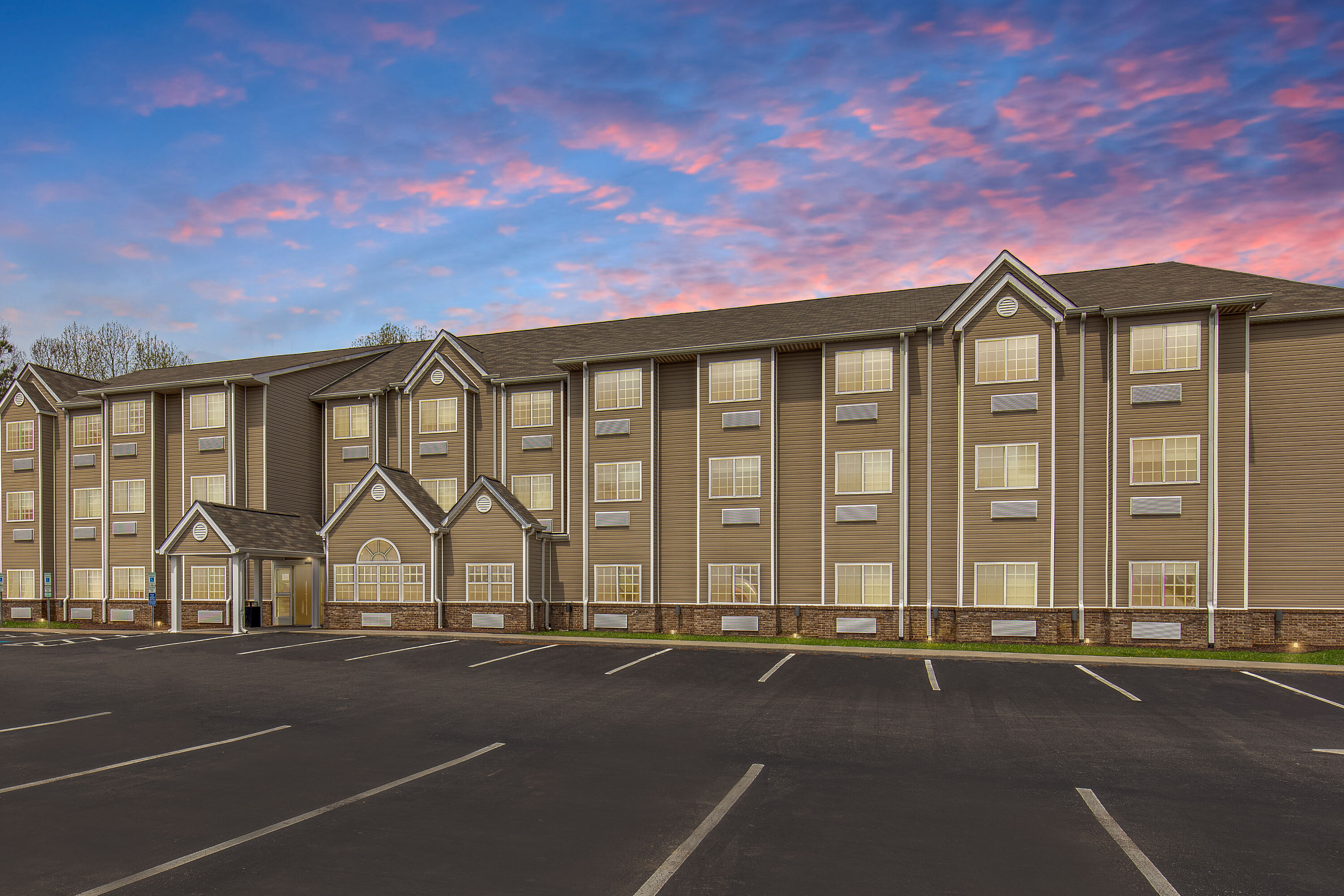 Exterior Dusk Image of Microtel Inn & Suites by Wyndham Manchester hotel in Manchester, Tennessee