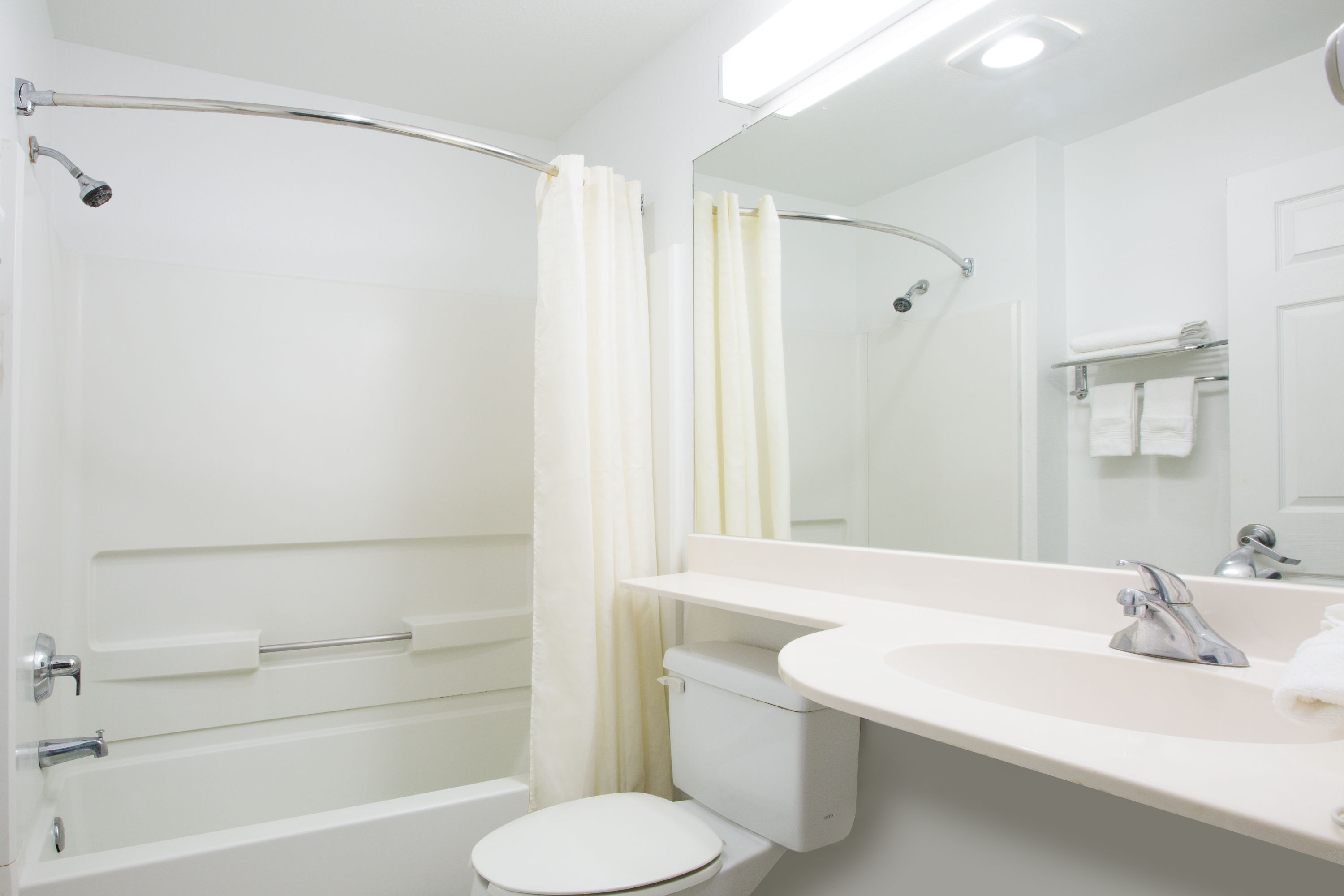 Guest room bath at the Microtel Inn & Suites by Wyndham Garland/Dallas in Garland, Texas