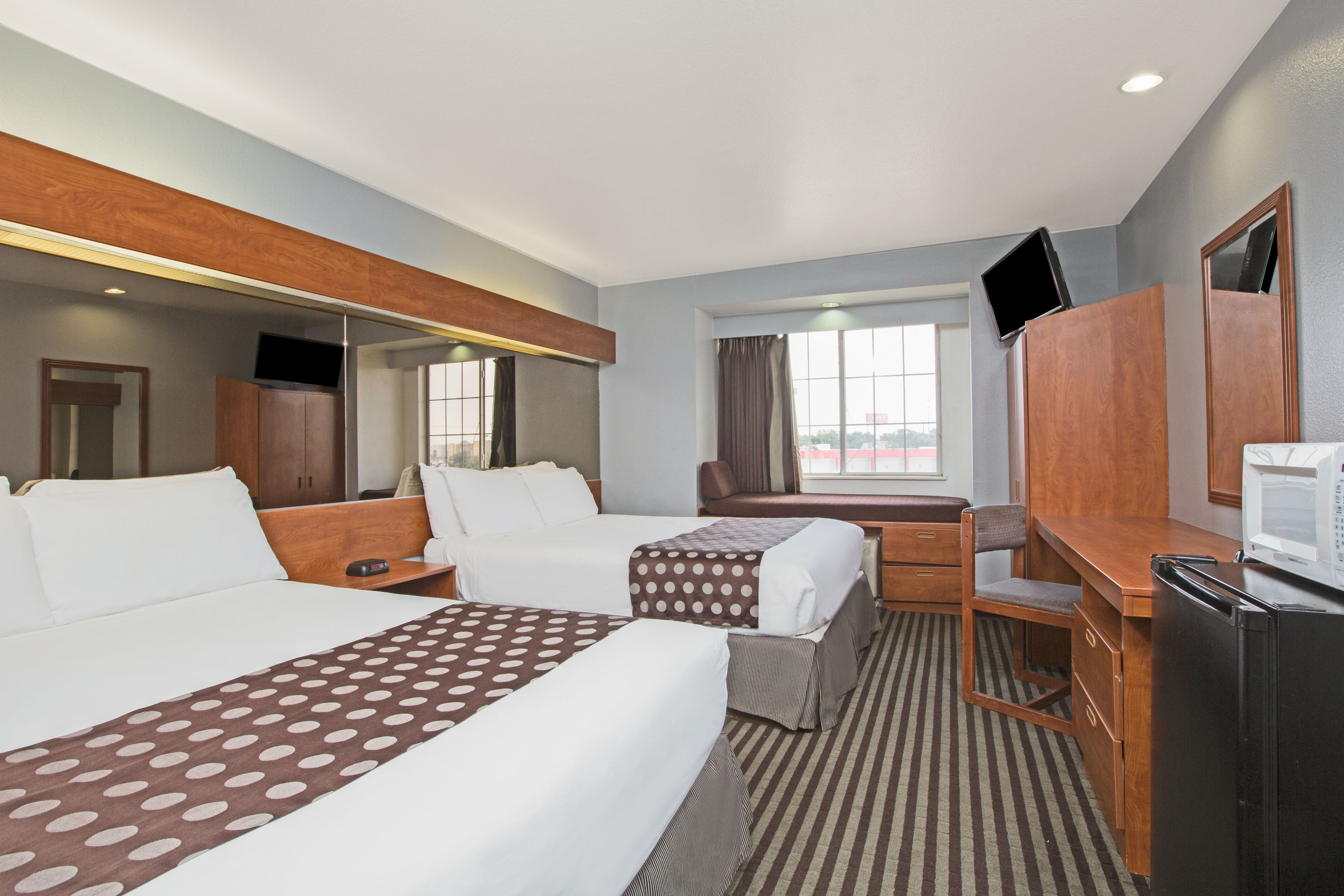 Guest room at the Microtel Inn & Suites by Wyndham Garland/Dallas in Garland, Texas