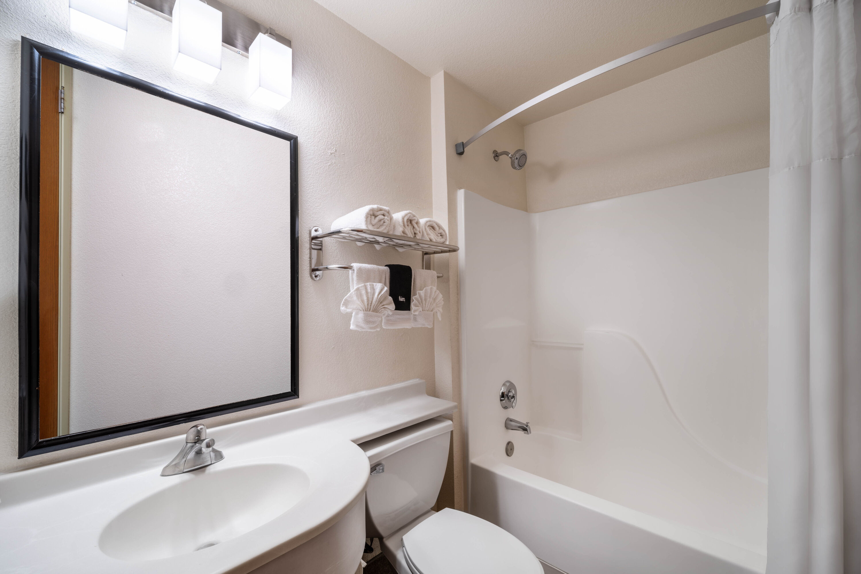 Guest room bath at the Microtel Inn & Suites by Wyndham Salt Lake City Airport in Salt Lake City, Utah
