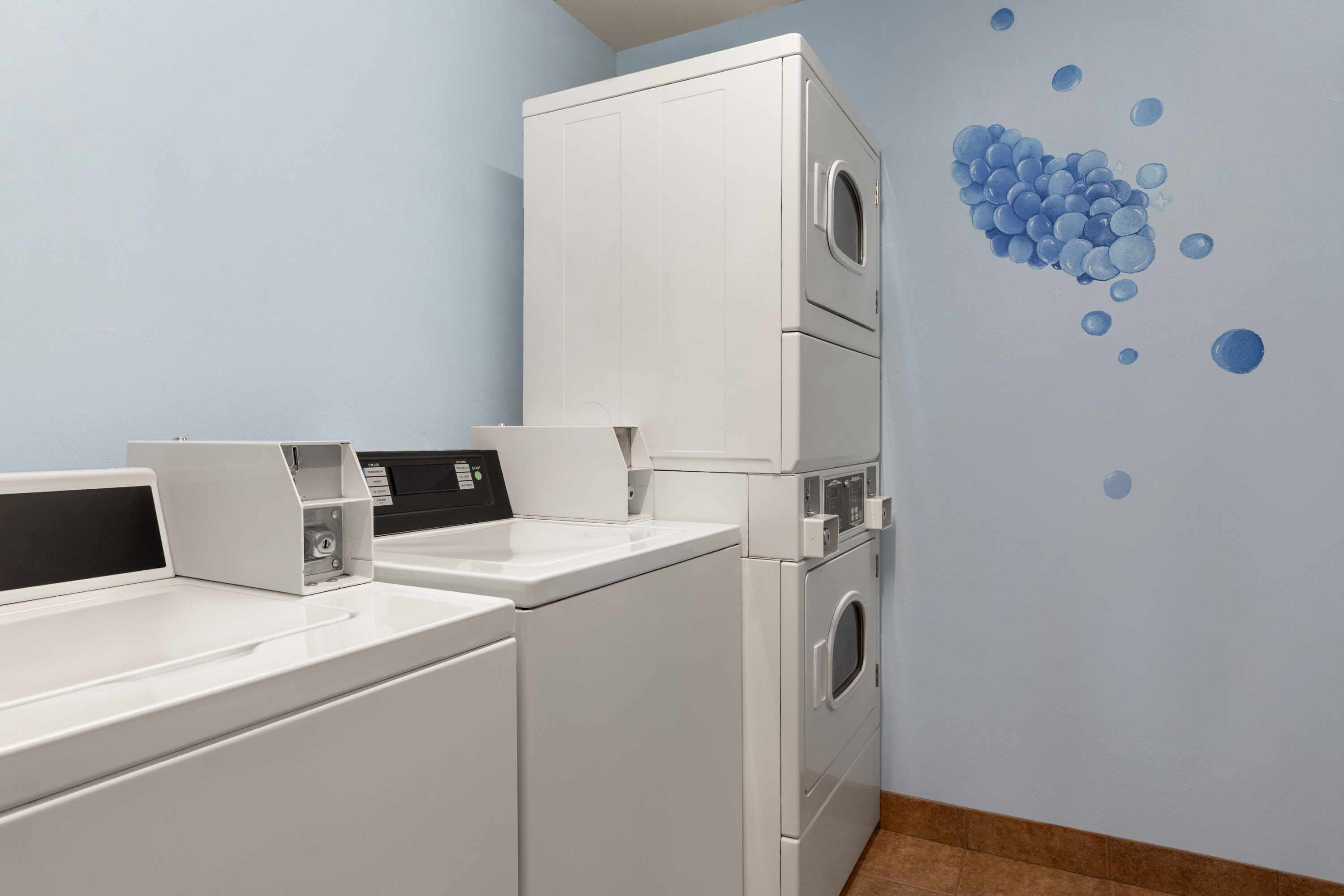 Laundry facilities at Microtel Inn & Suites by Wyndham Salt Lake City Airport in Salt Lake City, Utah