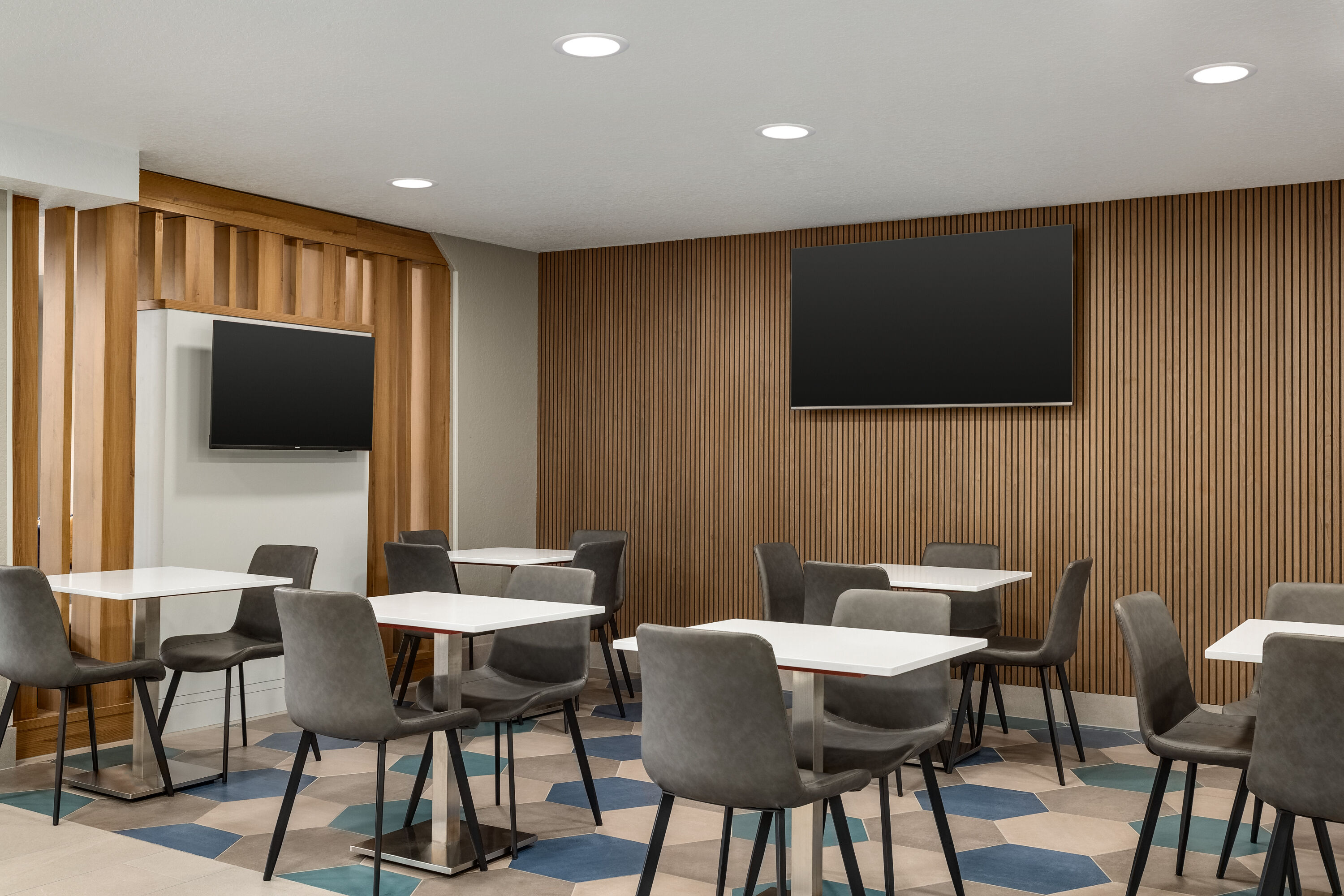 Microtel Inn & Suites by Wyndham Culpeper restaurant breakfast area with seating in Culpeper, Virginia