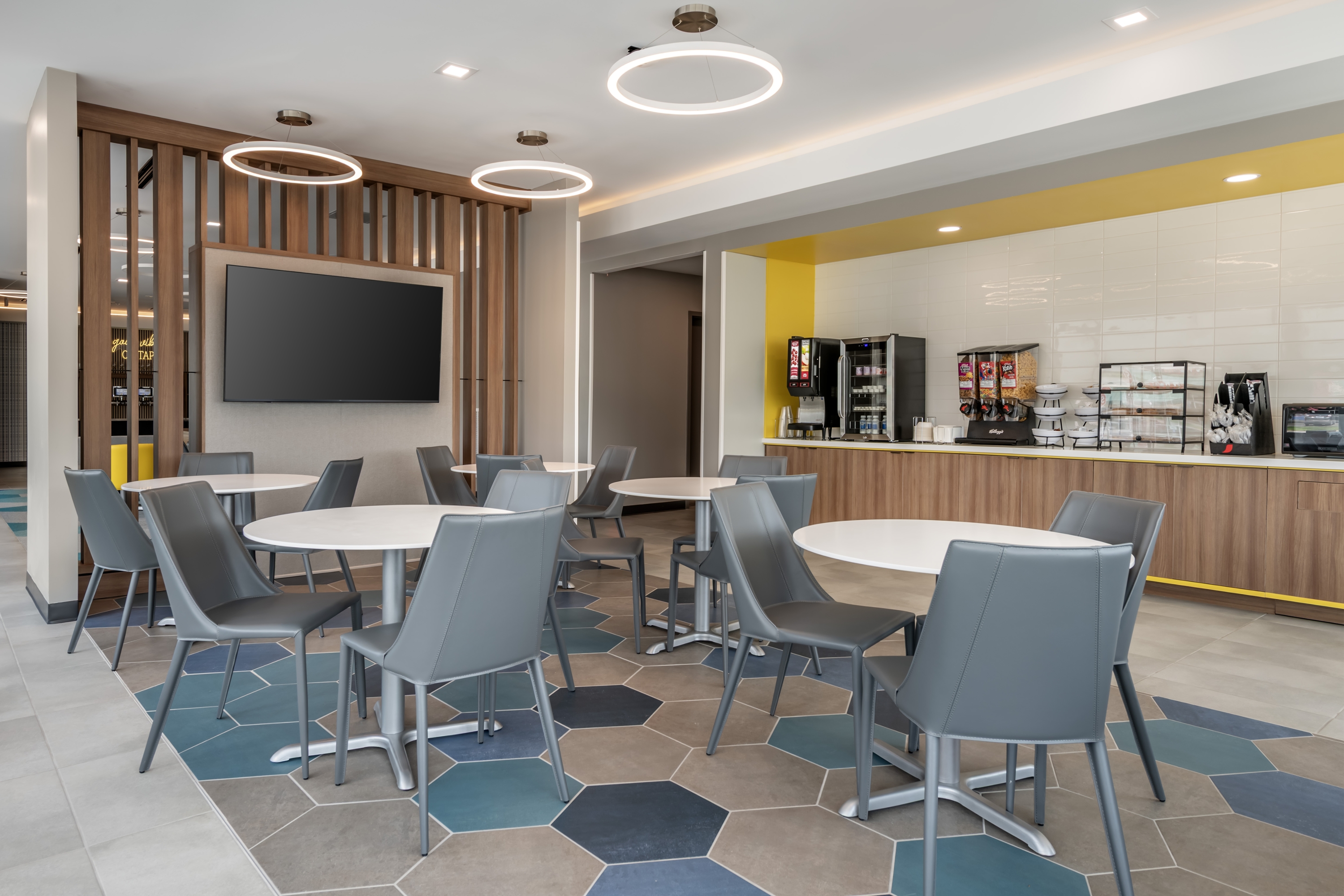 Microtel Inn & Suites by Wyndham Danville VA restaurant breakfast area with seating in Danville, Virginia