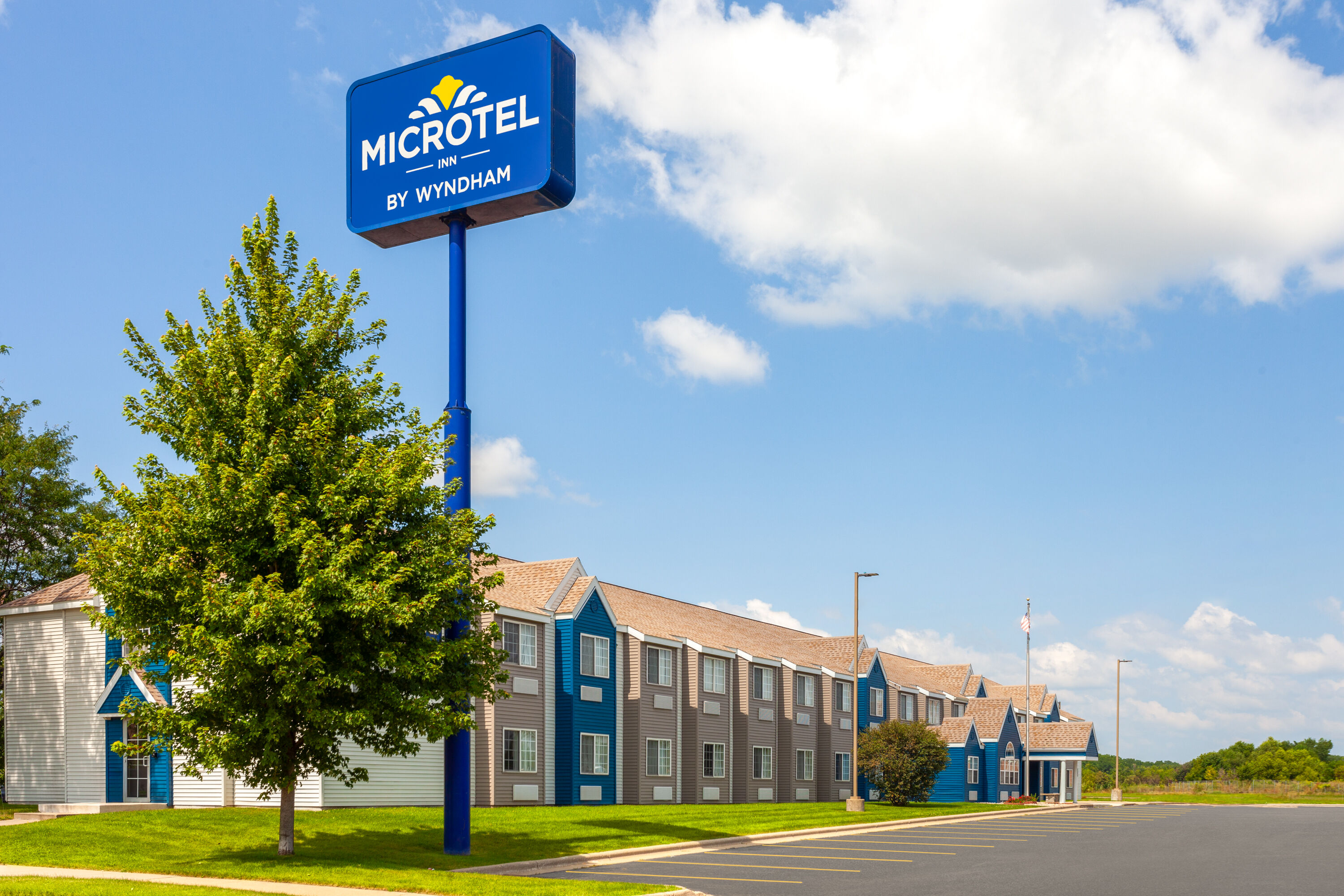 Exterior Day Image of Microtel Inn & Suites by Wyndham Janesville hotel in Janesville, Wisconsin
