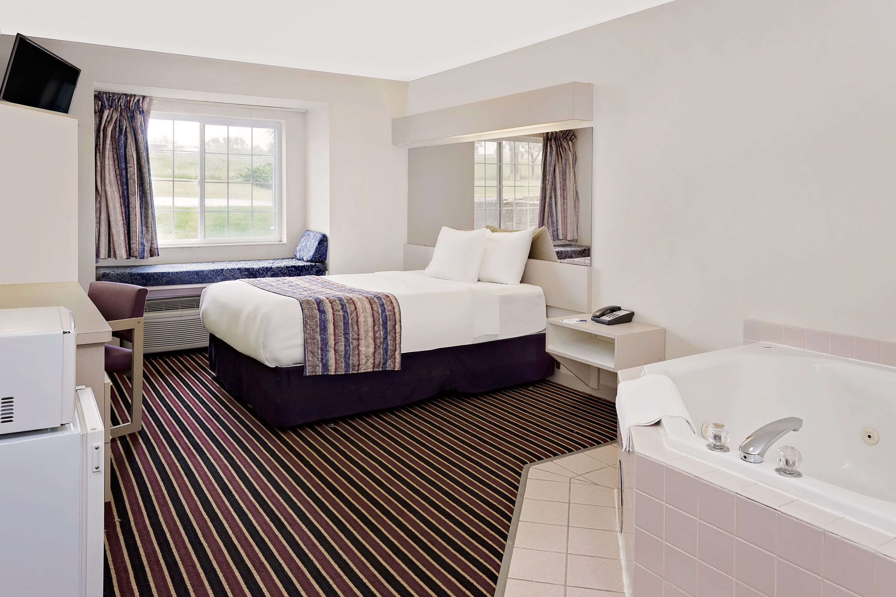 Guest room at the Microtel Inn & Suites by Wyndham Madison East in Madison, Wisconsin