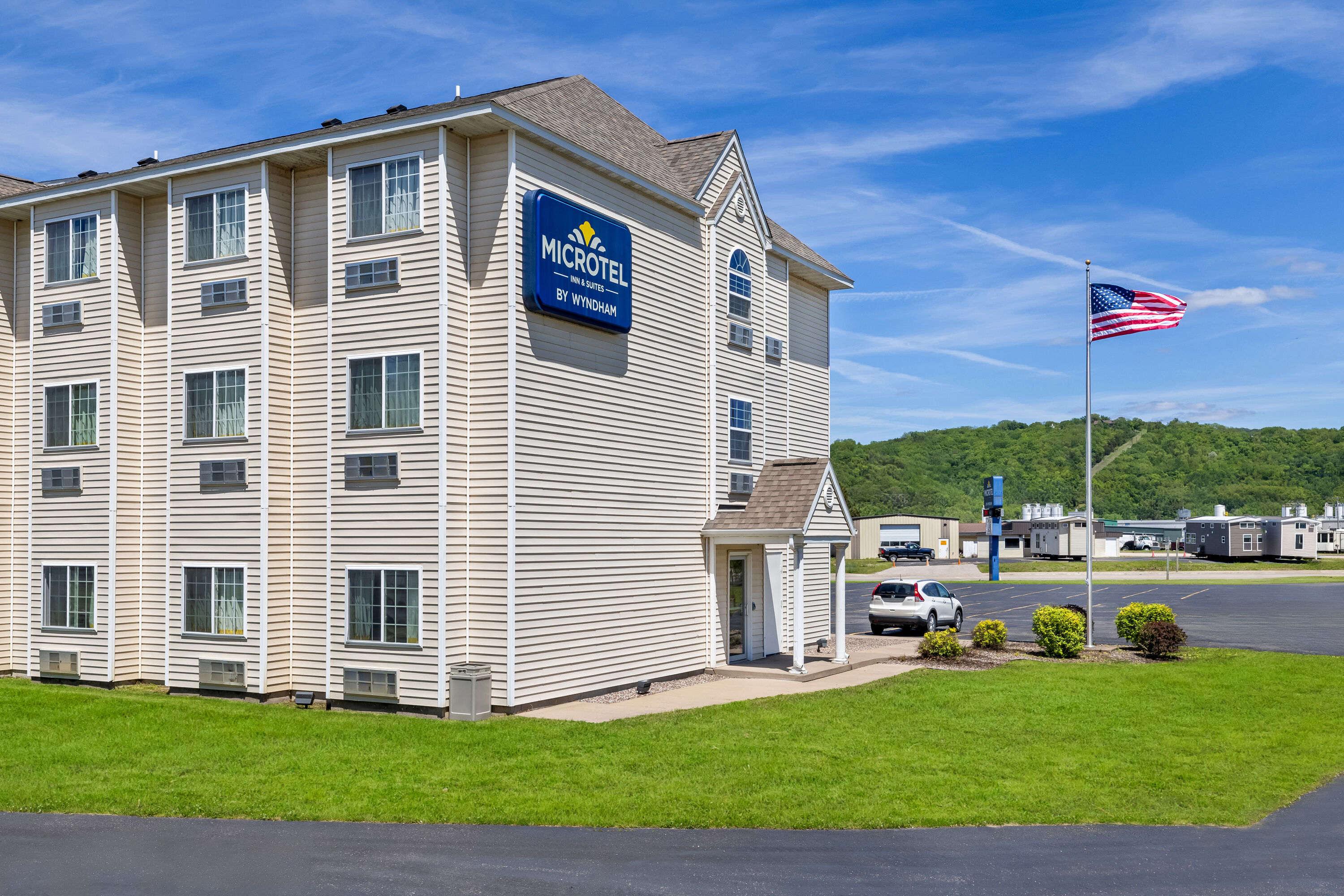 Exterior Day Image of Microtel Inn & Suites by Wyndham Prairie du Chien hotel in Prairie du Chien, Wisconsin