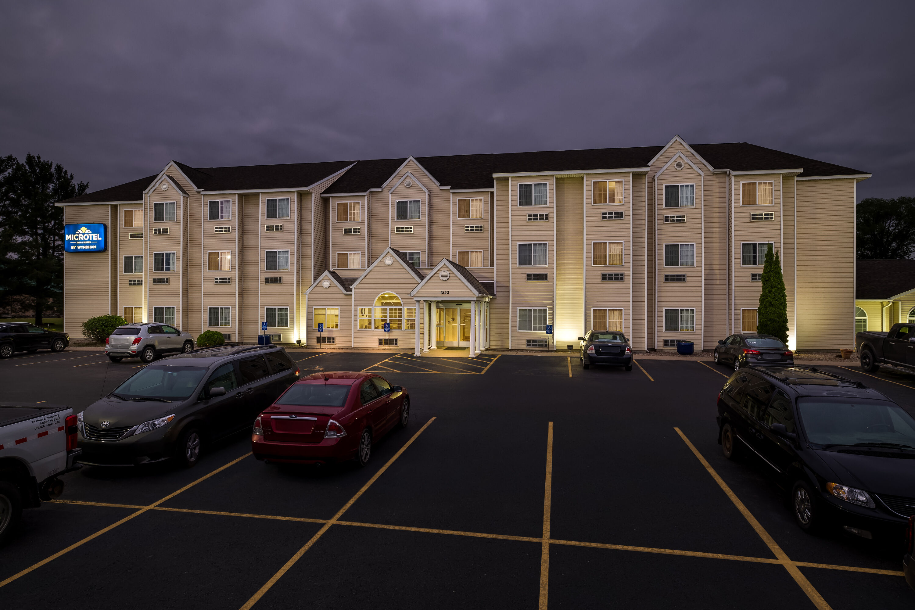Exterior Night Image of Microtel Inn & Suites by Wyndham Prairie du Chien hotel in Prairie du Chien, Wisconsin