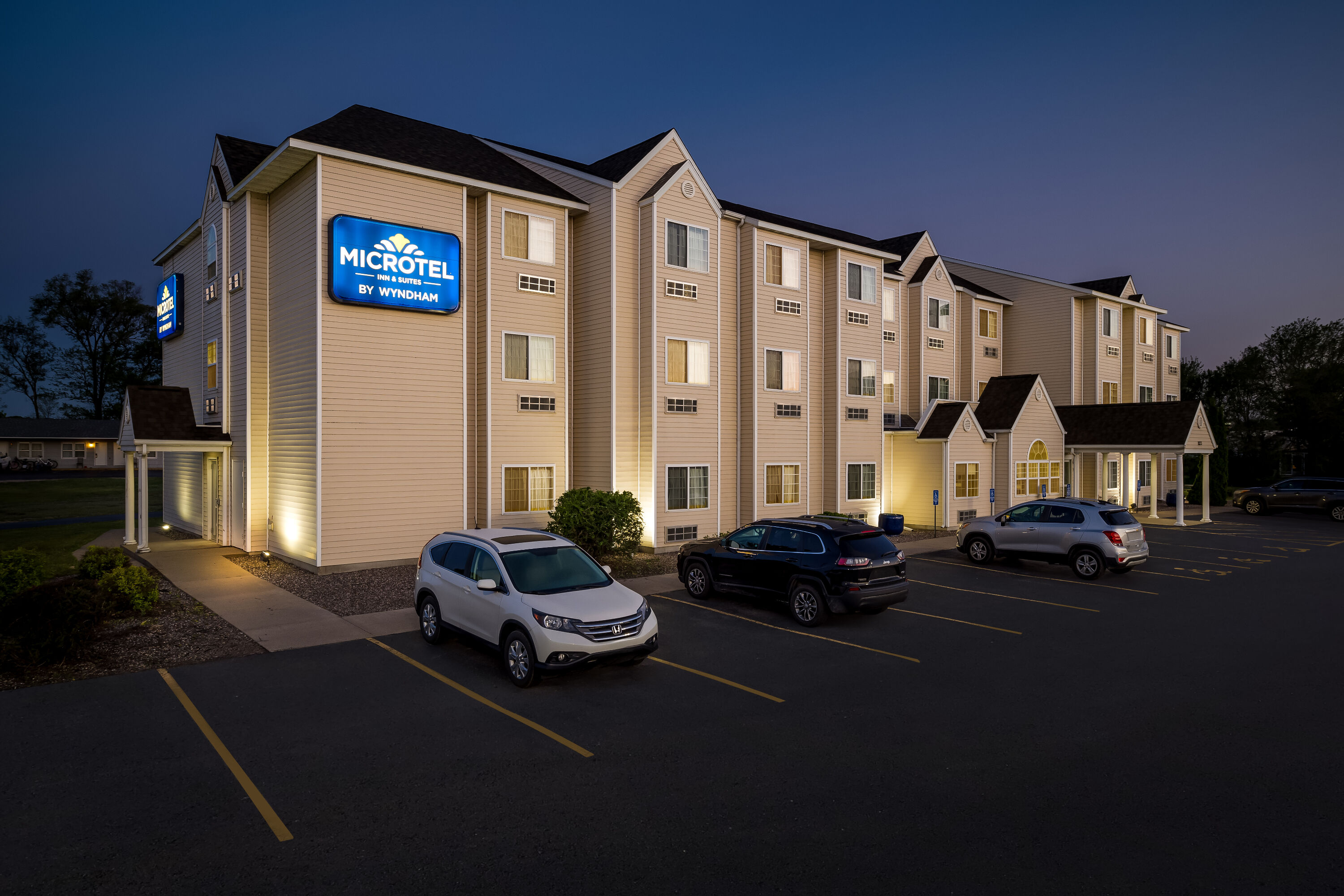 Exterior Night Image of Microtel Inn & Suites by Wyndham Prairie du Chien hotel in Prairie du Chien, Wisconsin