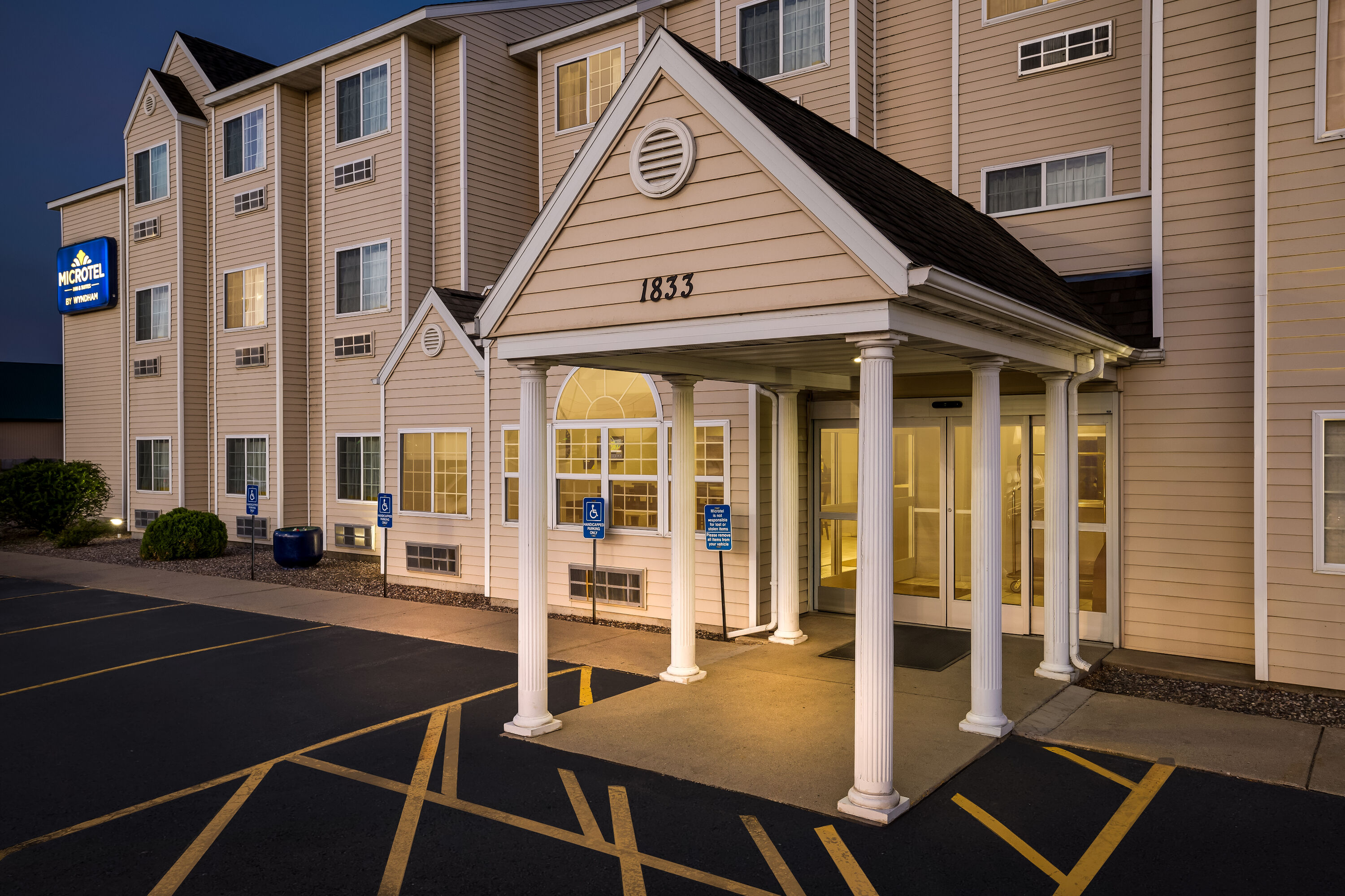 Exterior Night Image of Microtel Inn & Suites by Wyndham Prairie du Chien hotel in Prairie du Chien, Wisconsin
