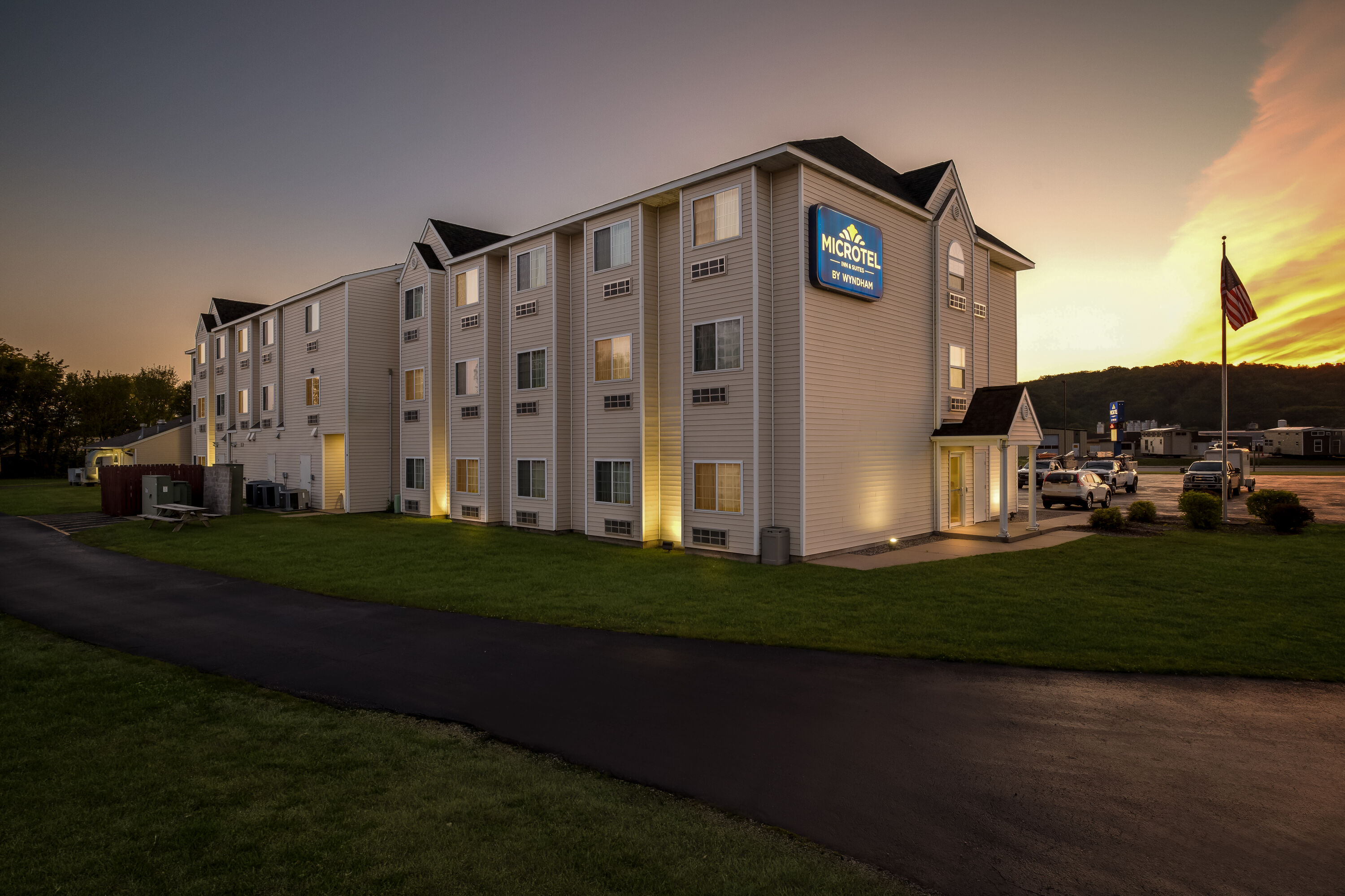 Exterior Night Image of Microtel Inn & Suites by Wyndham Prairie du Chien hotel in Prairie du Chien, Wisconsin