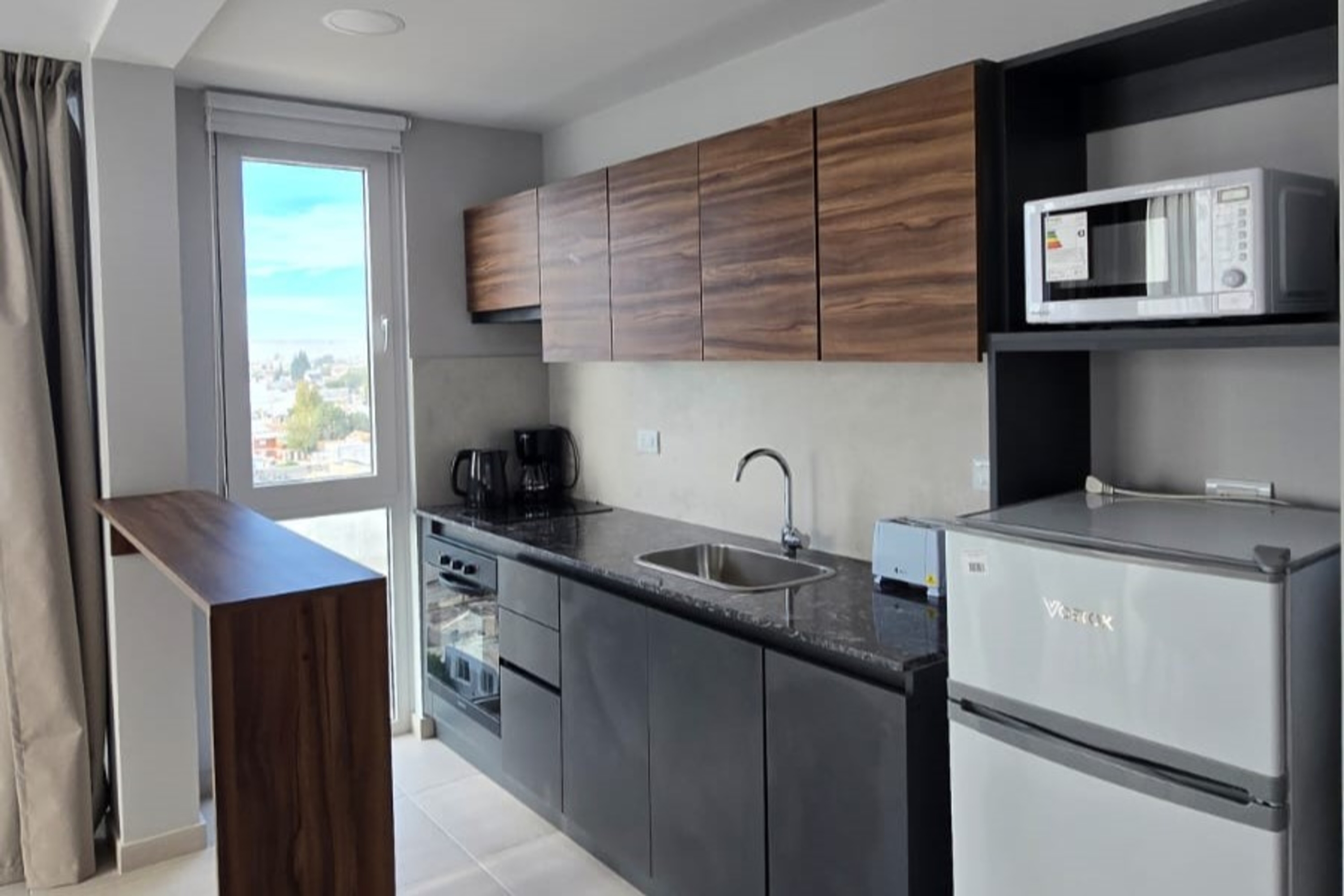 Guest room at the Ramada Residences by Wyndham Puerto Madryn CQ Gales in Puerto Madryn, Other than US/Canada