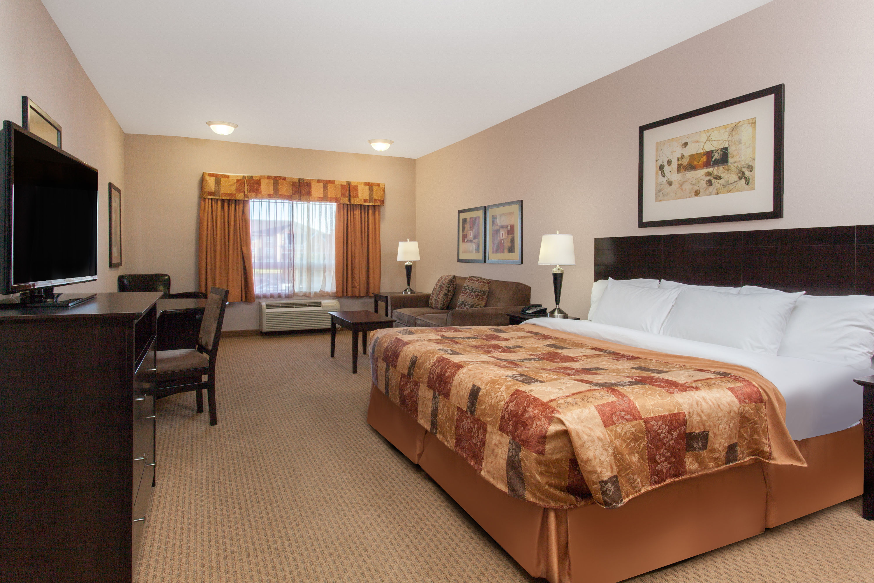 Guest room at the Ramada by Wyndham Brooks in Brooks, Alberta