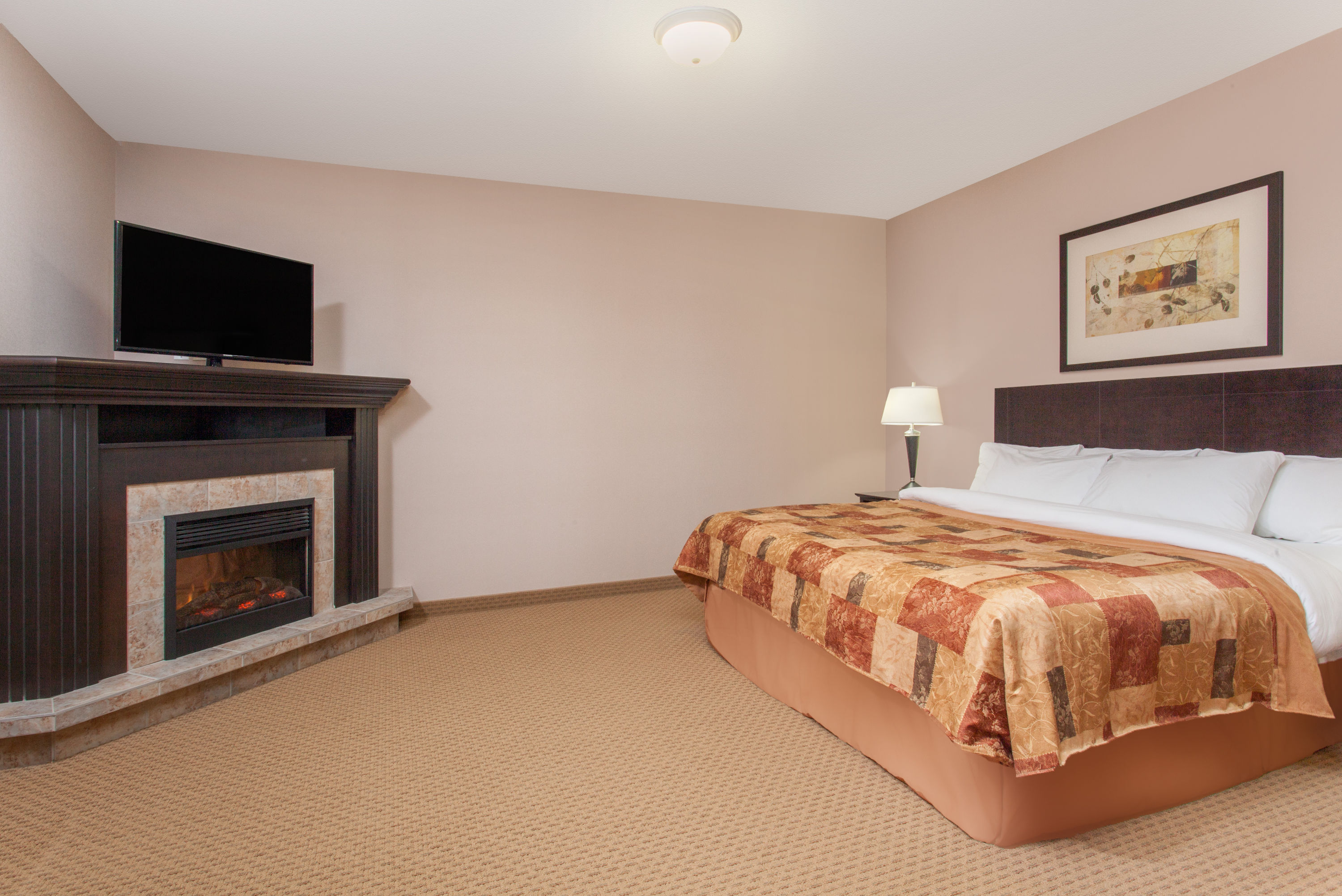 Guest room at the Ramada by Wyndham Brooks in Brooks, Alberta