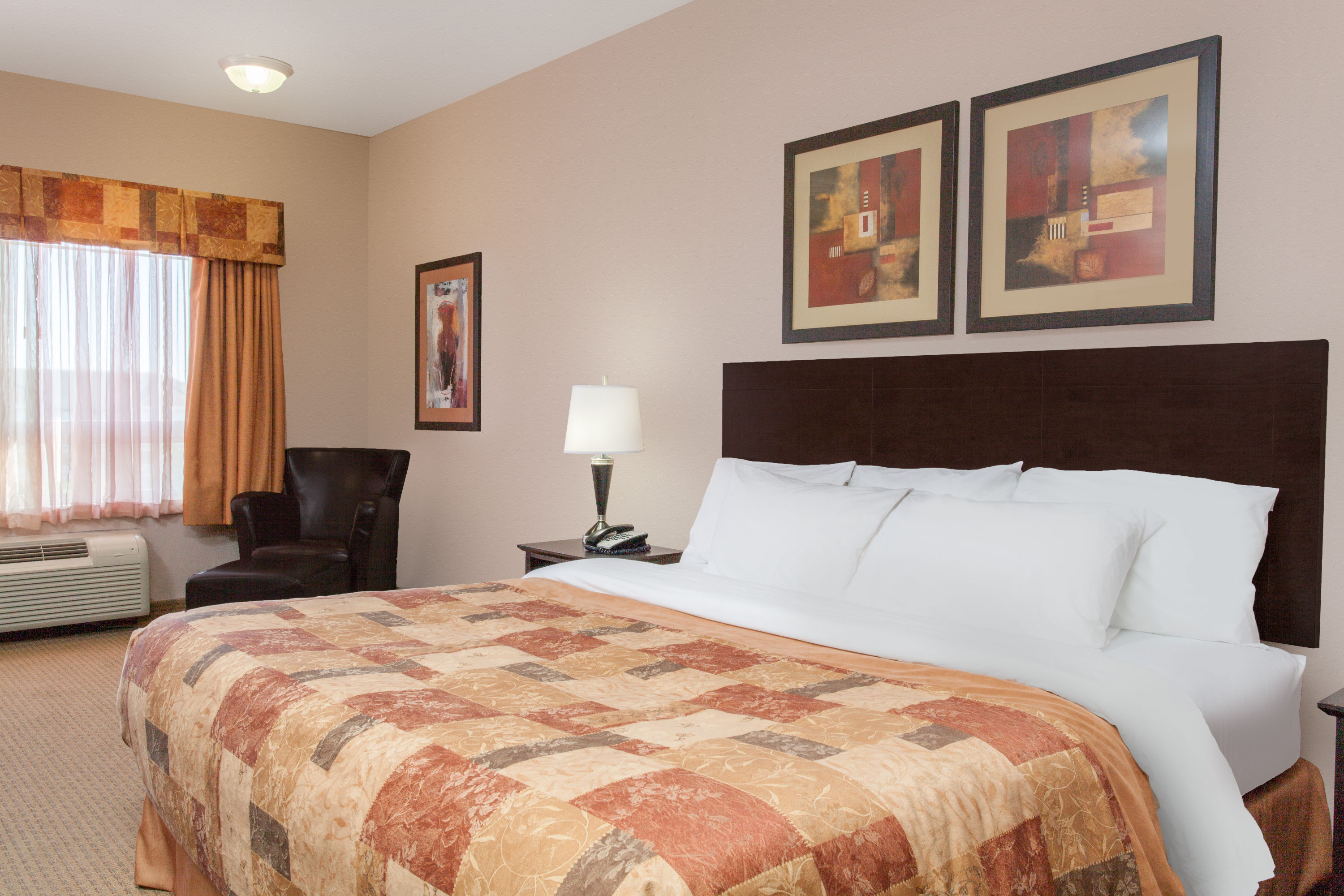 Guest room at the Ramada by Wyndham Brooks in Brooks, Alberta