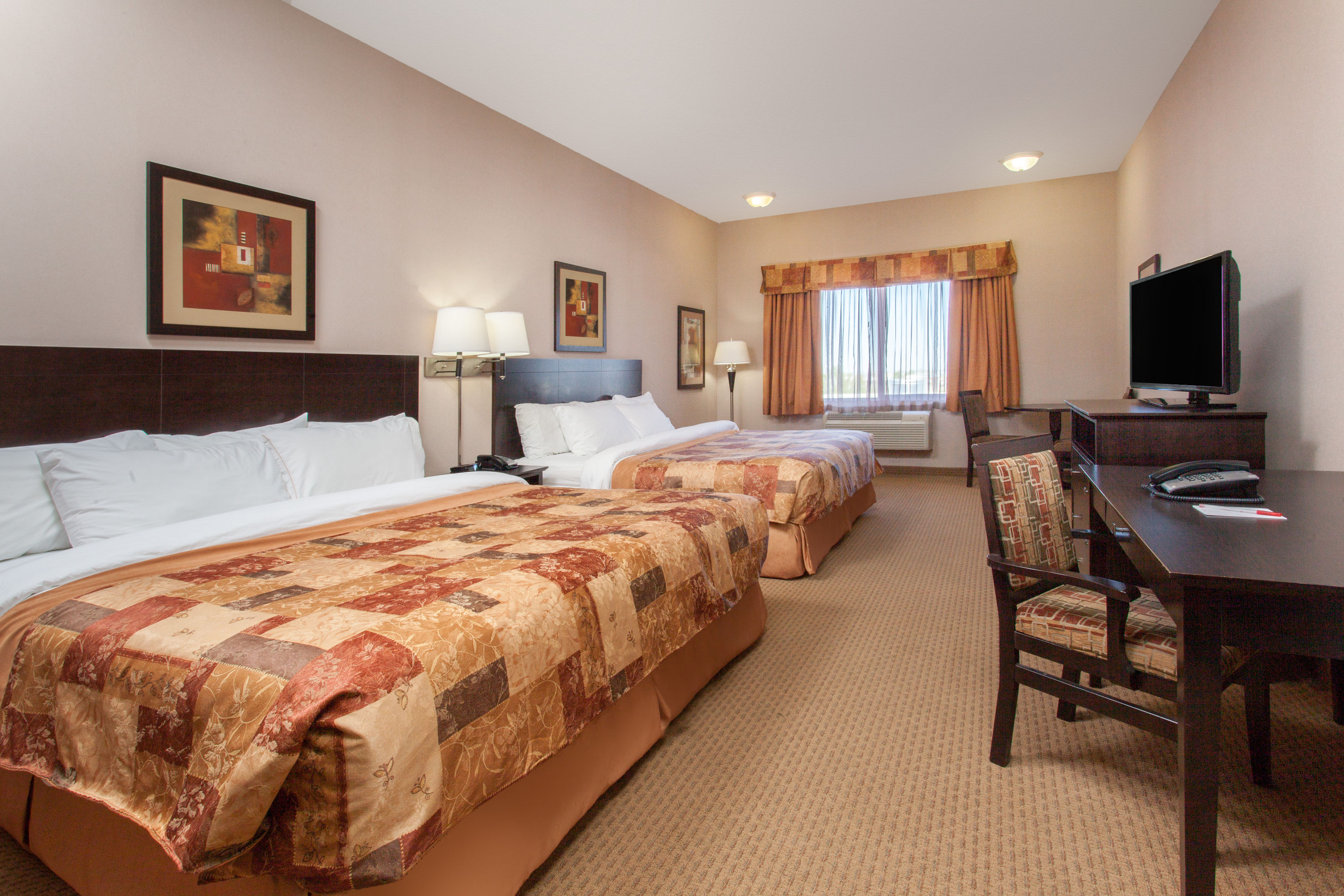 Guest room at the Ramada by Wyndham Brooks in Brooks, Alberta