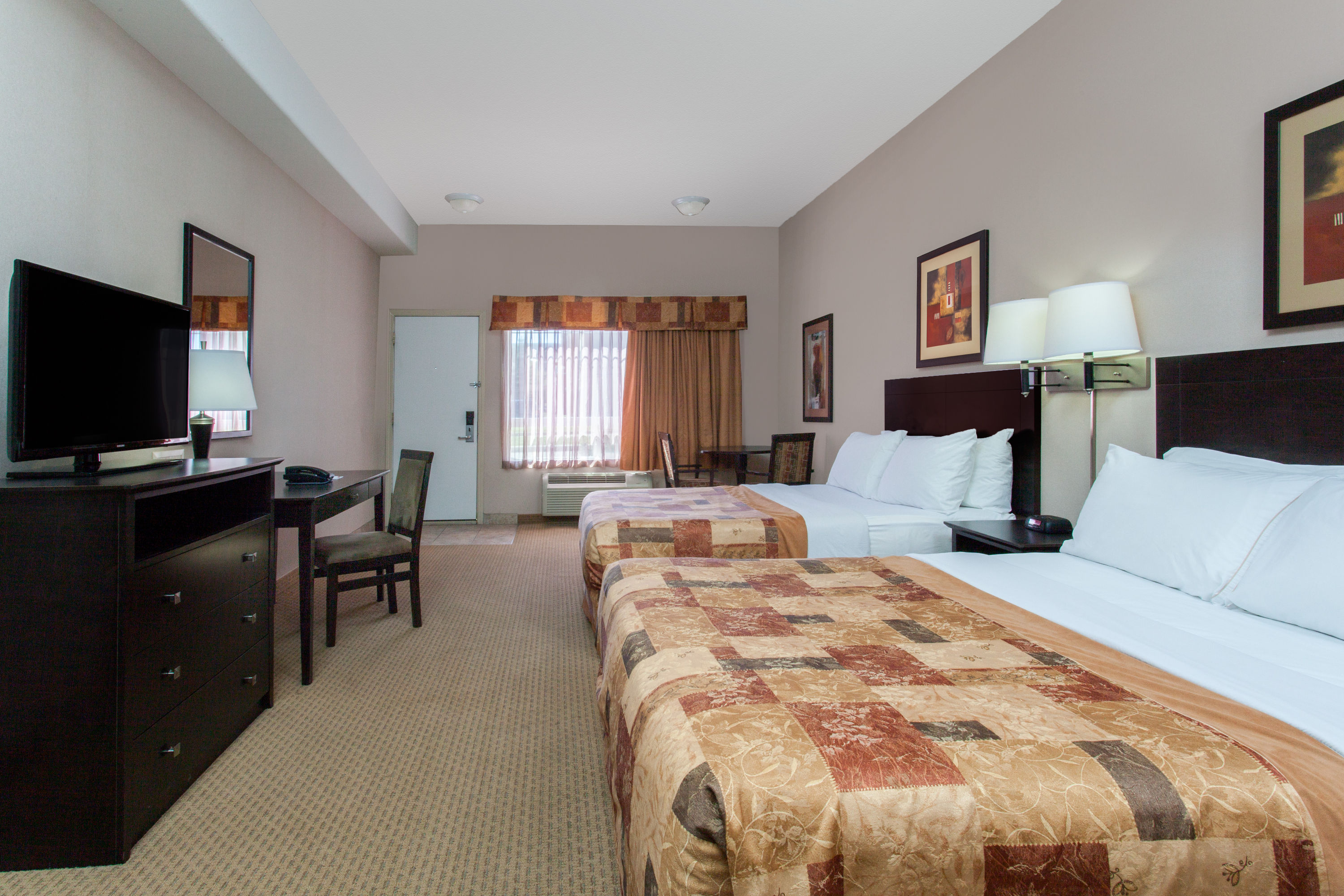 Guest room at the Ramada by Wyndham Brooks in Brooks, Alberta