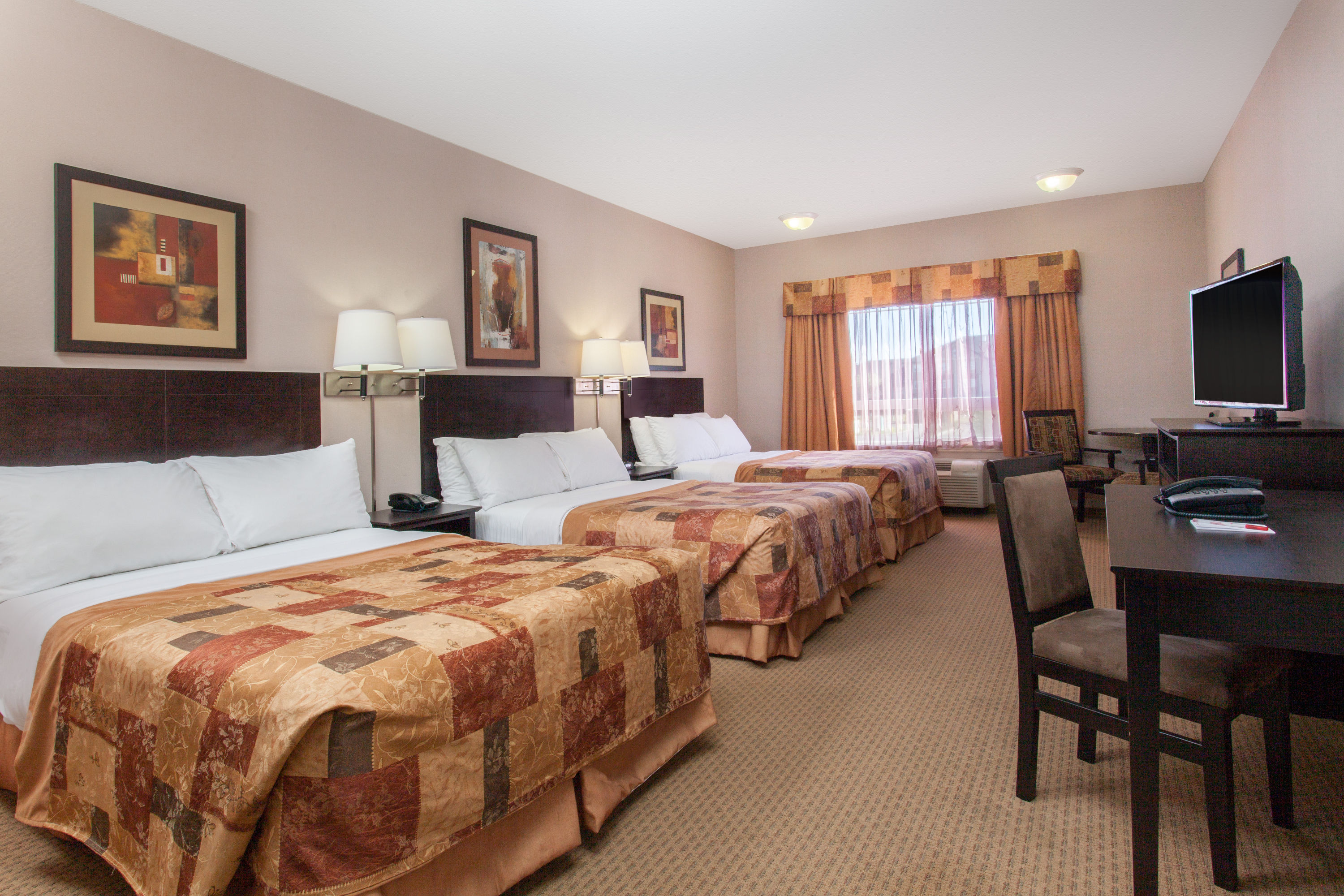 Guest room at the Ramada by Wyndham Brooks in Brooks, Alberta