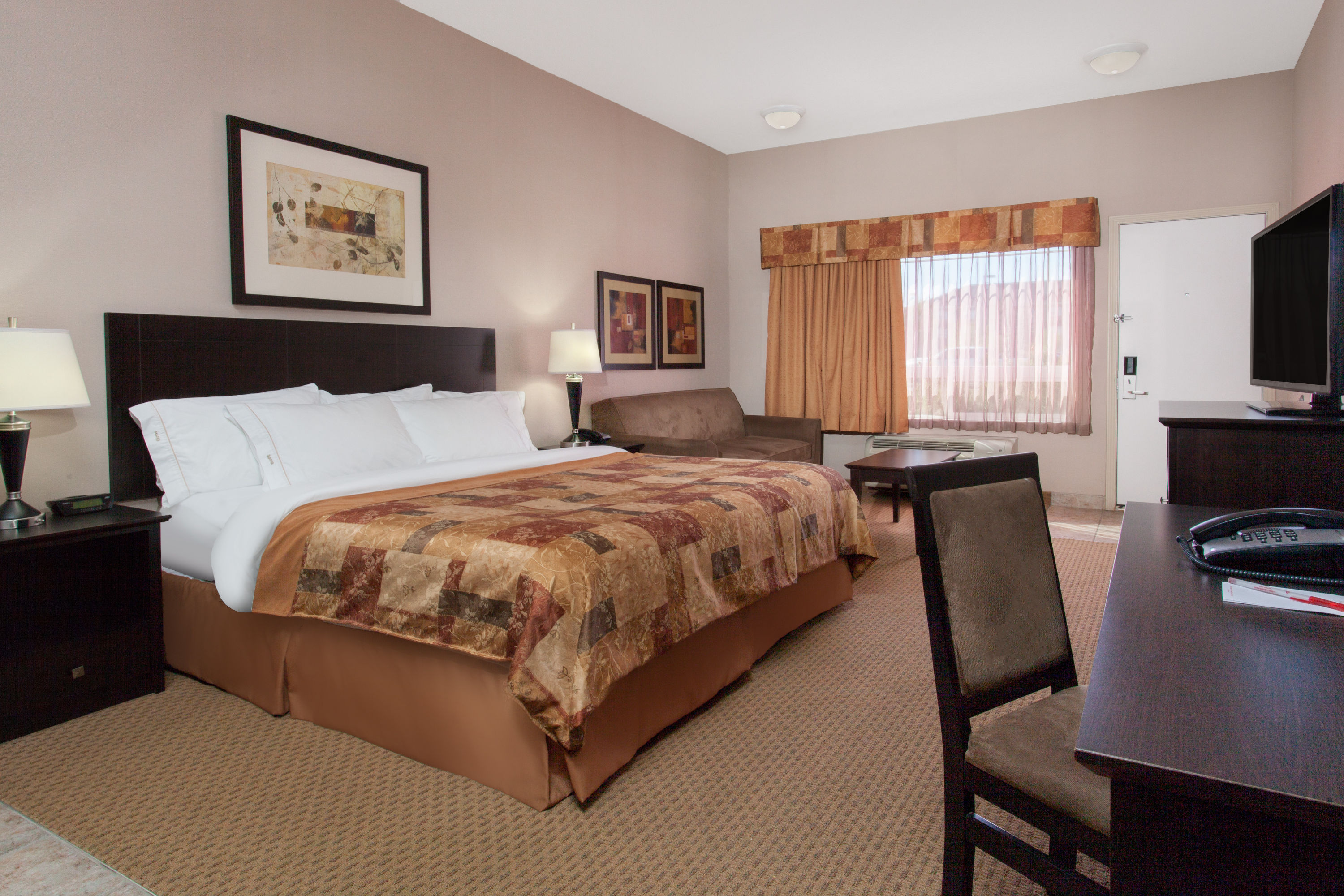 Guest room at the Ramada by Wyndham Brooks in Brooks, Alberta