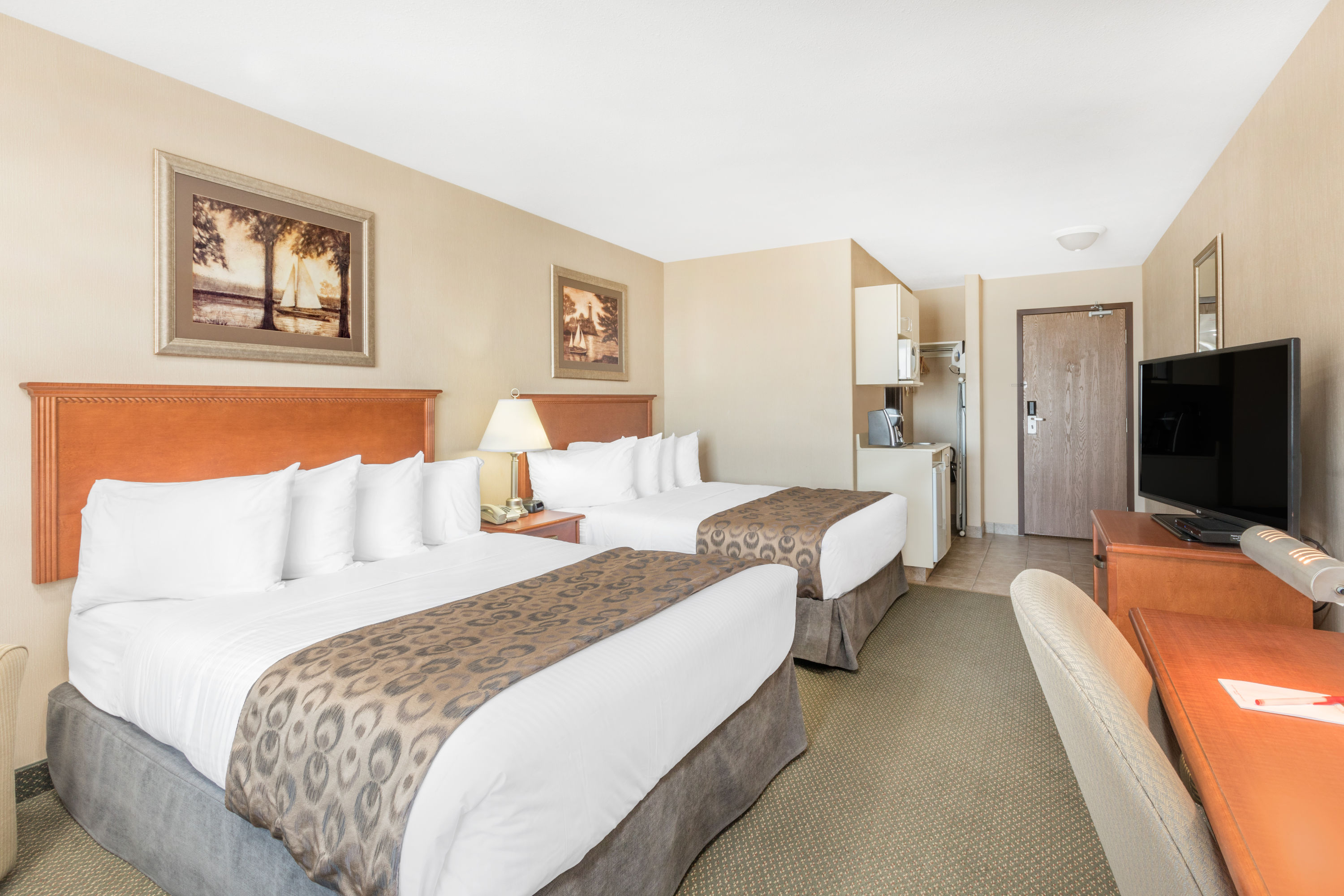 Guest room at the Ramada by Wyndham Clairmont/Grande Prairie in Clairmont, Alberta