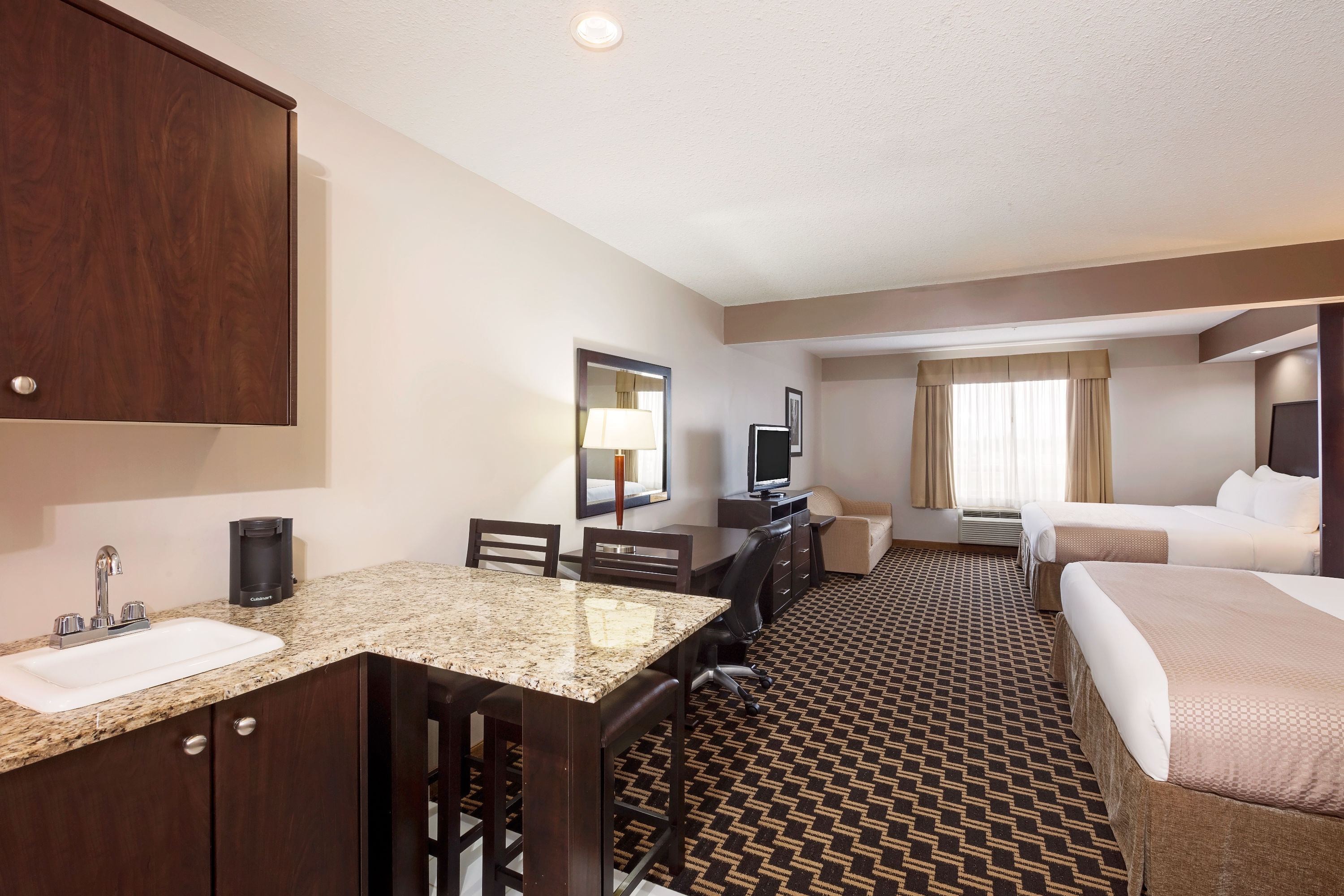 Guest room at the Ramada by Wyndham Cold Lake in Cold Lake, Alberta