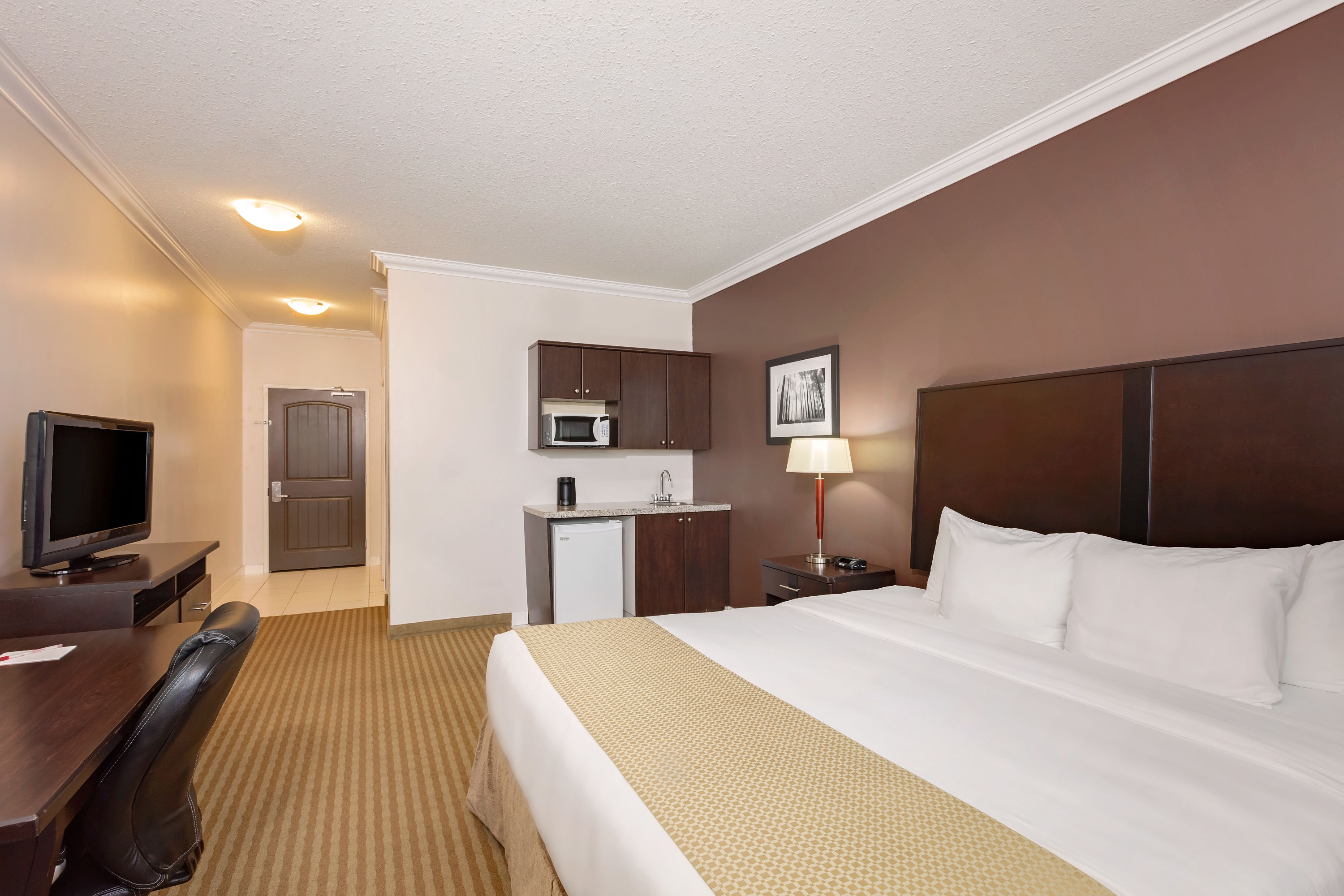 Guest room at the Ramada by Wyndham Cold Lake in Cold Lake, Alberta