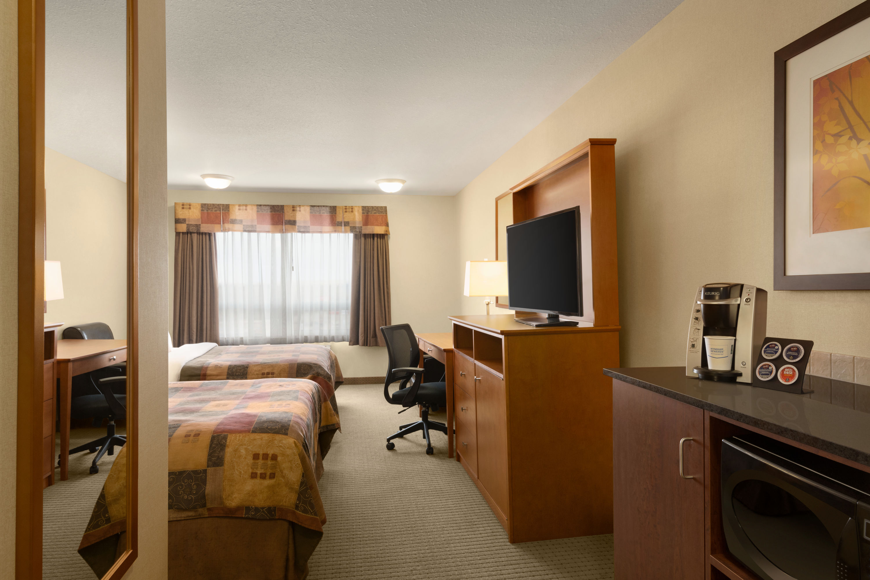 Guest room at the Ramada by Wyndham Drayton Valley in Drayton Valley, Alberta