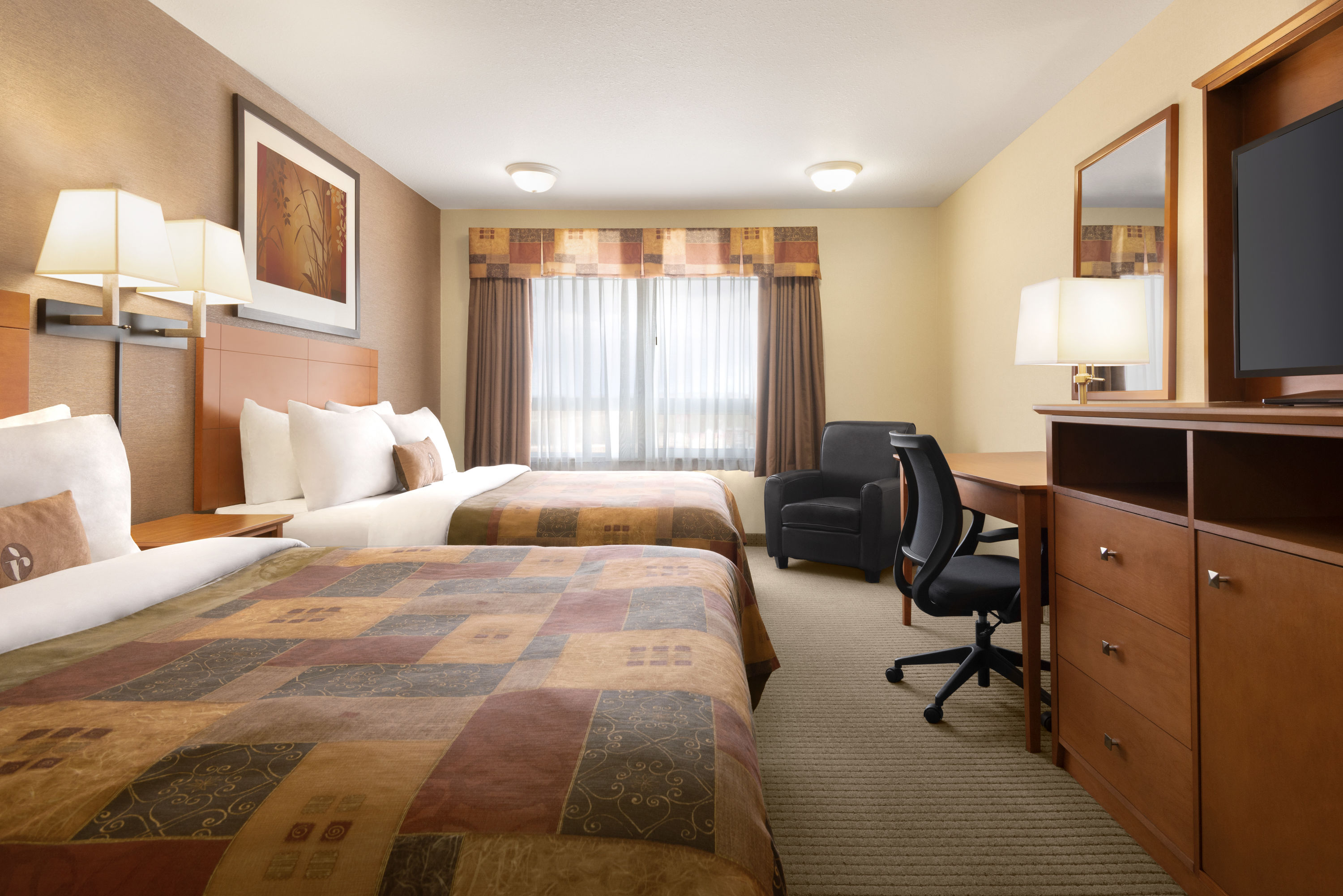 Guest room at the Ramada by Wyndham Drayton Valley in Drayton Valley, Alberta