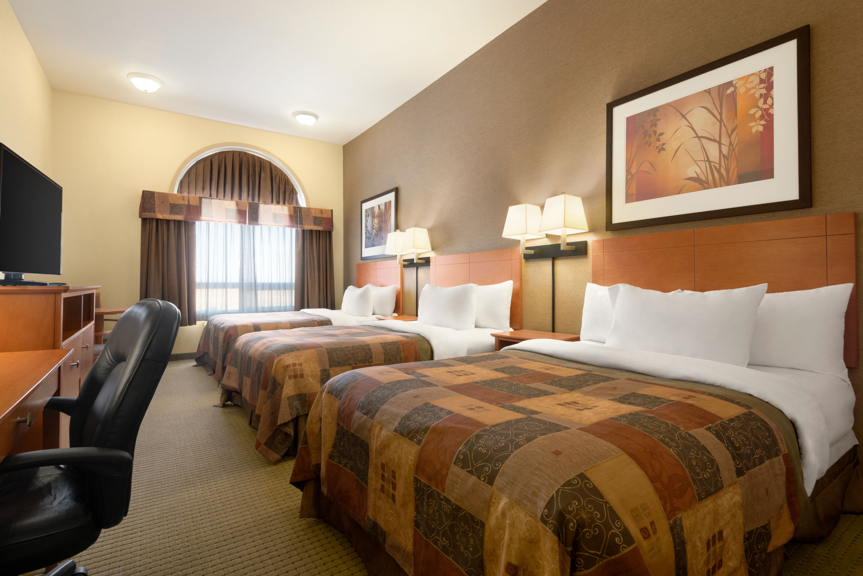 Guest room at the Ramada by Wyndham Drayton Valley in Drayton Valley, Alberta