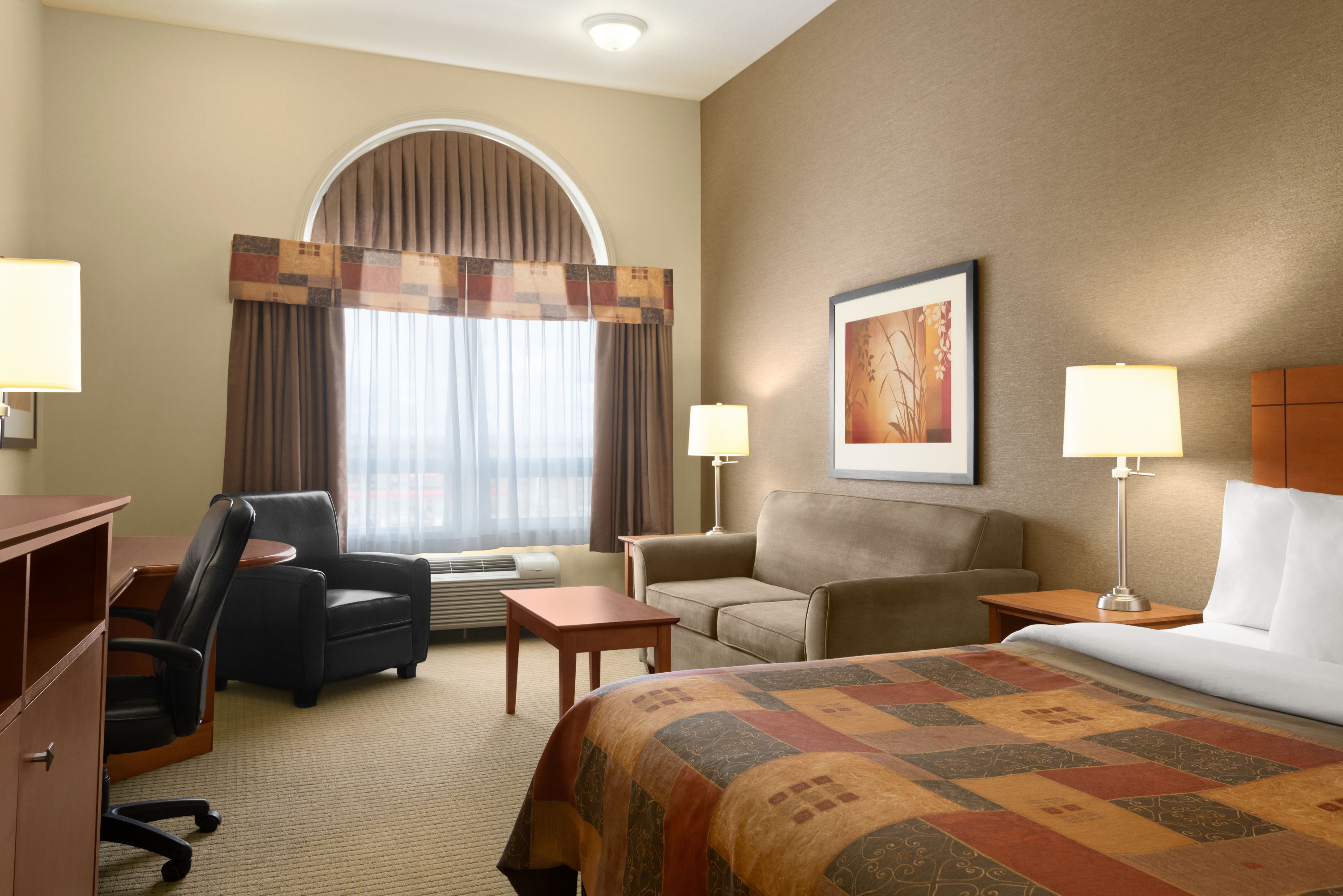 Guest room at the Ramada by Wyndham Drayton Valley in Drayton Valley, Alberta